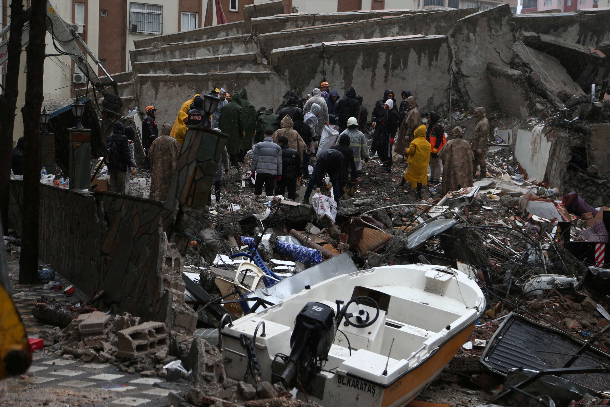 Rescuers work at the site of a collapsed building following an earthquake in Adana, Turkey February 6, 2023. REUTERS