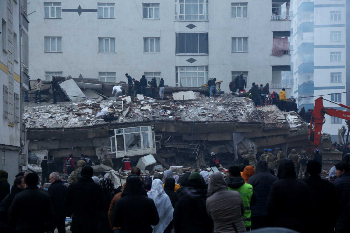 People search for survivors under the rubble following an earthquake in Diyarbakir, Turkey February 6, 2023. REUTERS