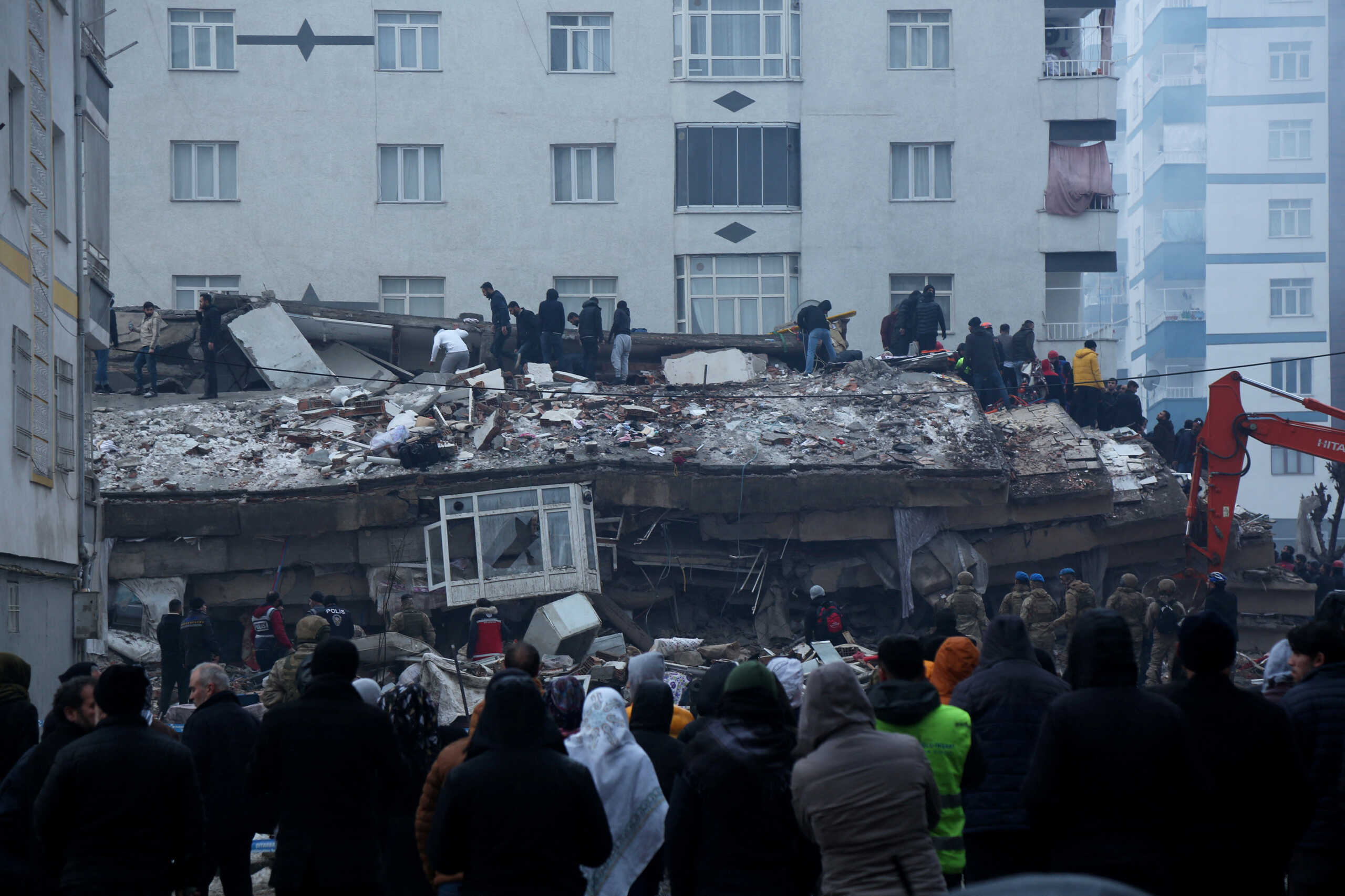 People search for survivors under the rubble following an earthquake in Diyarbakir, Turkey February 6, 2023. REUTERS
