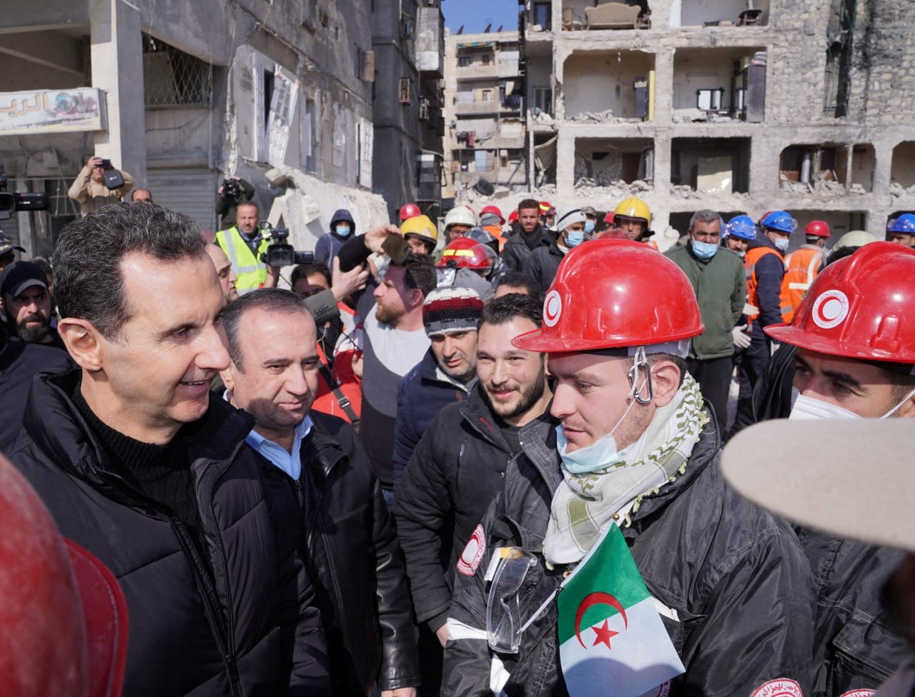 Syrian President Bashar al-Assad meets with Algerian rescue team at the site of a damaged building, in the aftermath of the earthquake in Aleppo, in this handout released by Syrian Presidency on February 10, 2023. SYRIAN PRESIDENCY