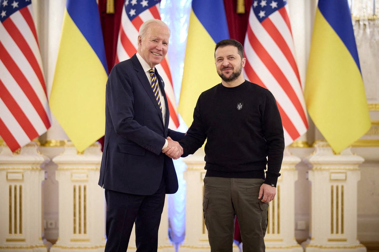 Ukraine's President Volodymyr Zelenskiy and U.S. President Joe Biden shake hands before a meeting, amid Russia's attack on Ukraine, in Kyiv, Ukraine February 20, 2023. Ukrainian Presidential Press Service