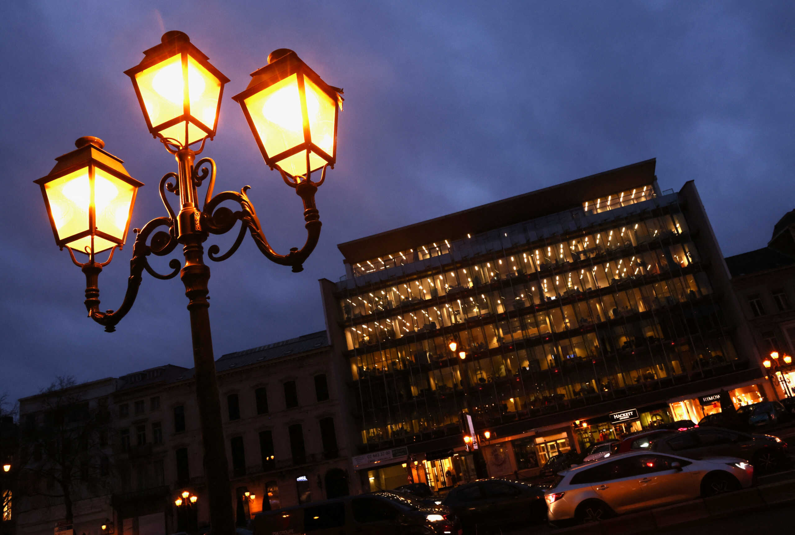 Lights are seen in an office building in Brussels, Belgium February 2, 2023. REUTERS