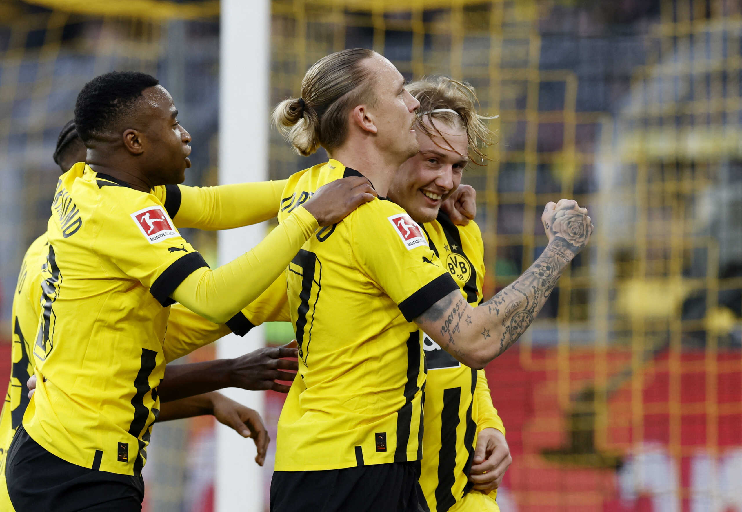 Soccer Football - Bundesliga - Borussia Dortmund v SC Freiburg - Signal Iduna Park, Dortmund, Germany - February 4, 2023 Borussia Dortmund's Julian Brandt celebrates with teammates after scoring their fourth goal REUTERS