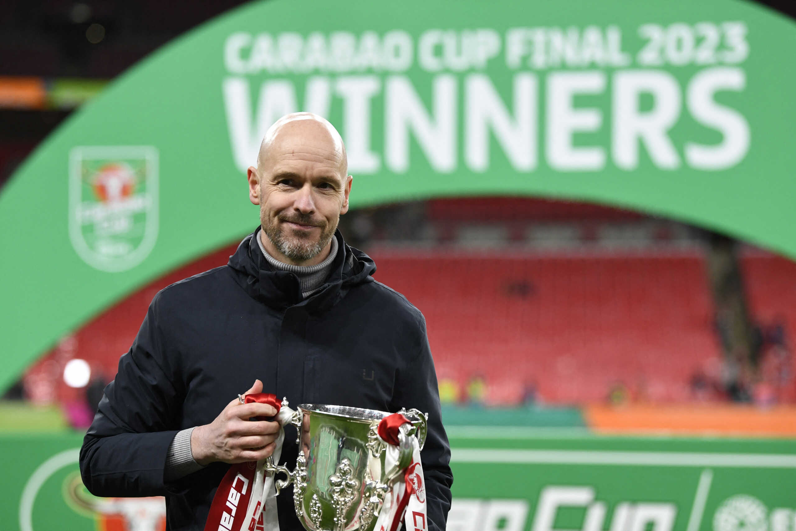 Soccer Football - Carabao Cup - Final - Manchester United v Newcastle United - Wembley Stadium, London, Britain - February 26, 2023  Manchester United manager Erik ten Hag celebrates with the trophy after winning the Carabao Cup REUTERS