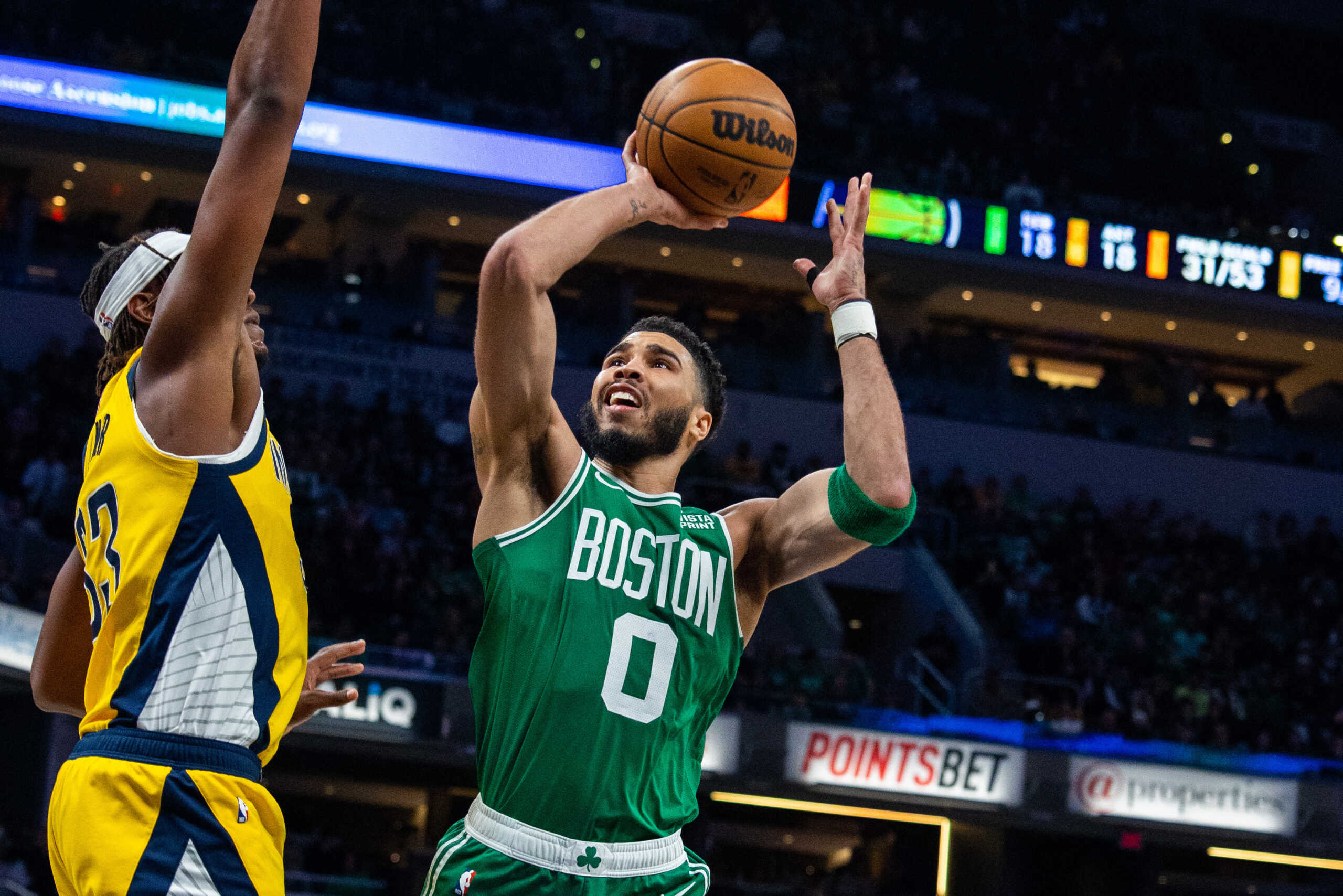 Feb 23, 2023; Indianapolis, Indiana, USA; Boston Celtics forward Jayson Tatum (0) shoots the ball while Indiana Pacers center Myles Turner (33) defends in the second half at Gainbridge Fieldhouse. Mandatory Credit: Trevor Ruszkowski-USA TODAY Sports