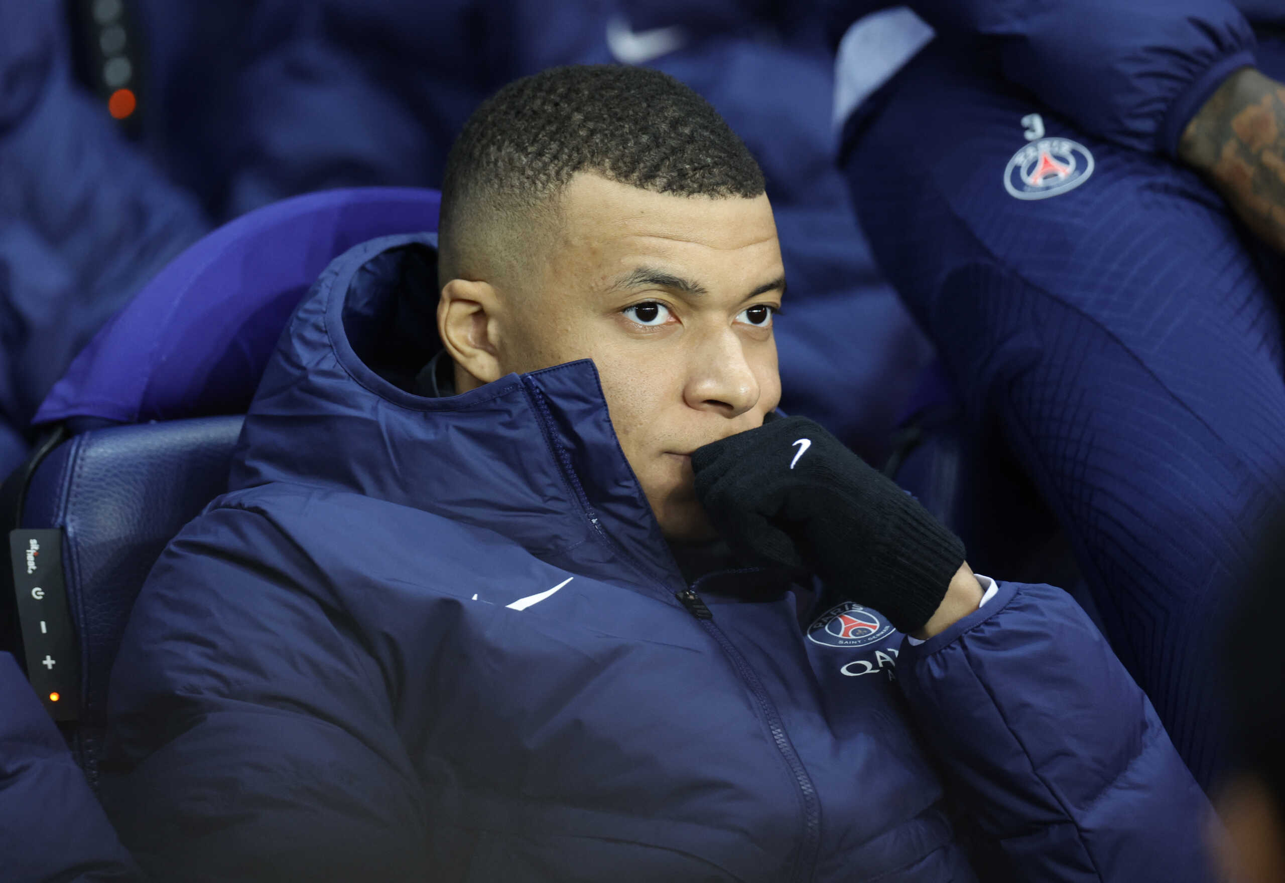 Soccer Football - Champions League - Round of 16 First Leg - Paris St Germain v Bayern Munich - Parc des Princes, Paris, France - February 14, 2023  Paris St Germain's Kylian Mbappe on the bench ahead of the match REUTERS