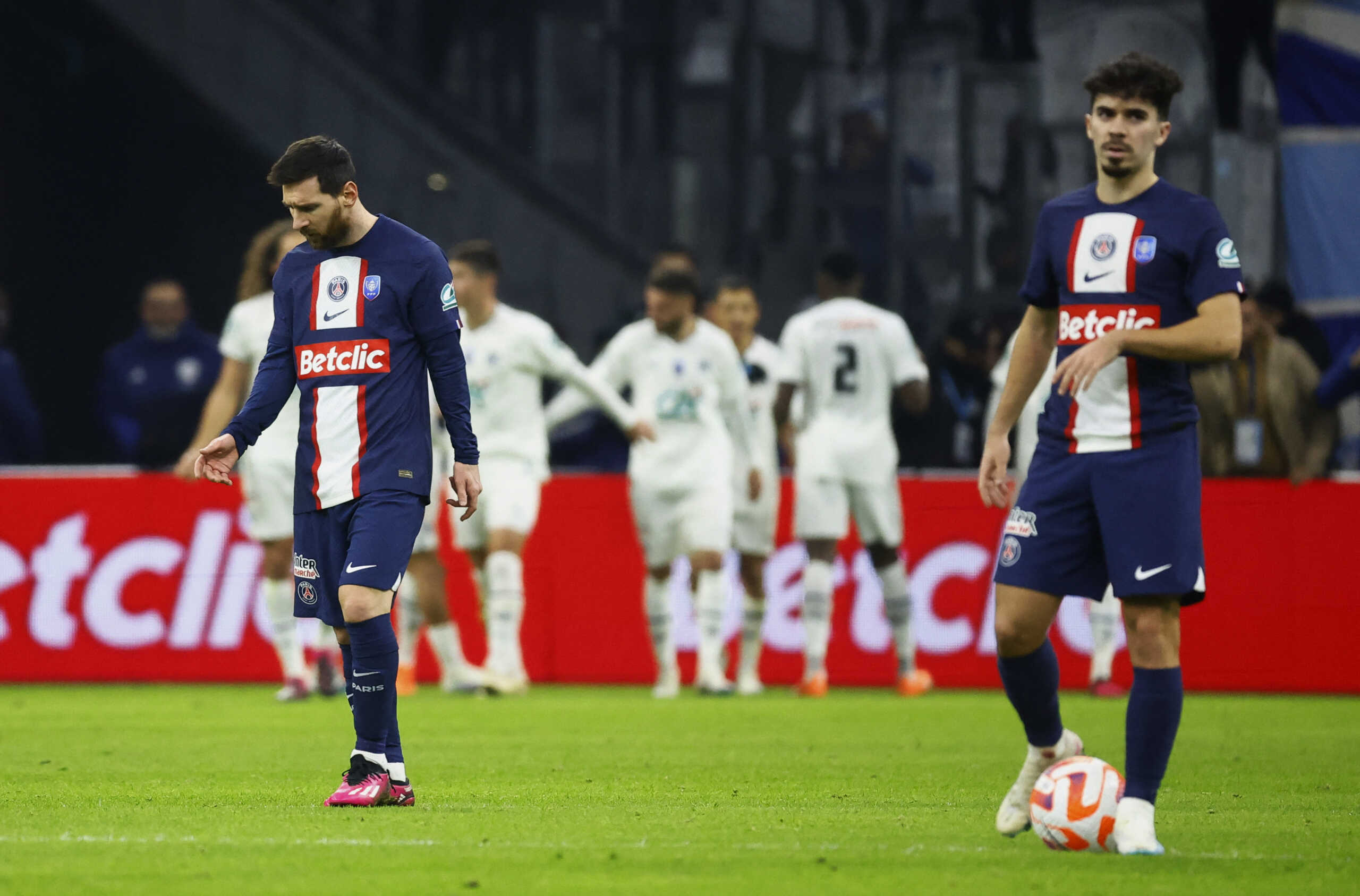 Soccer Football - Coupe de France - Round of 16 - Olympique de Marseille v Paris St Germain - Orange Velodrome, Marseille, France - February 8, 2023  Paris St Germain's Lionel Messi and Vitinha react after Olympique de Marseille's Alexis Sanchez scores their first goal REUTERS