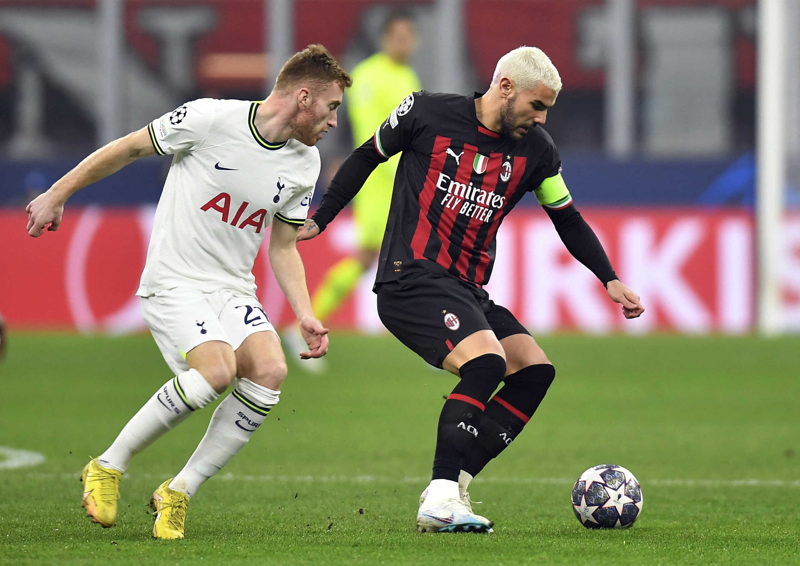 Soccer Football - Champions League - Round of 16 First Leg - AC Milan v Tottenham Hotspur - San Siro, Milan, Italy - February 14, 2023  Tottenham Hotspur's Dejan Kulusevski in action with AC Milan's Theo Hernandez REUTERS
