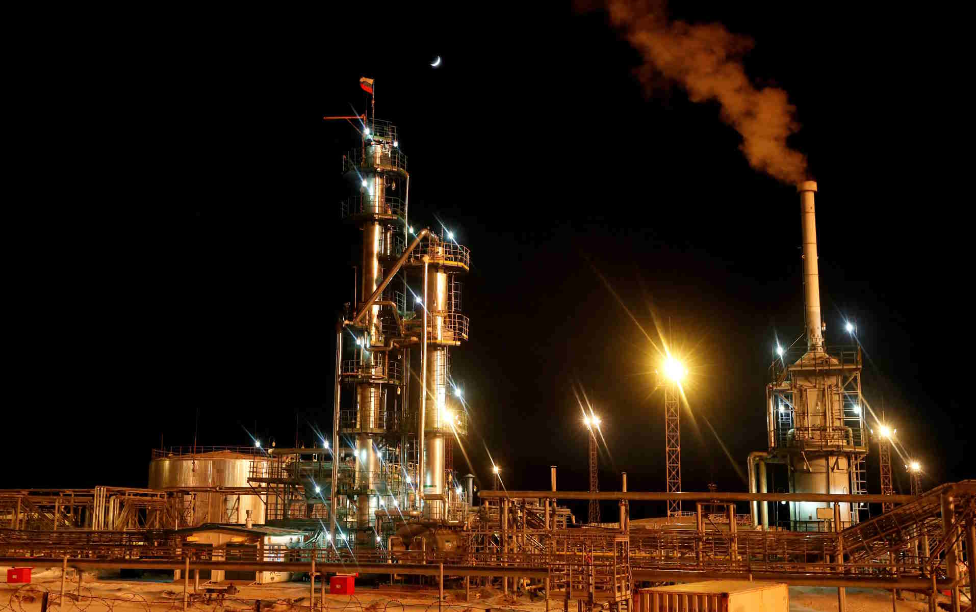 FILE PHOTO: A Russian state flag flies on the top of a diesel plant in the Yarakta Oil Field, owned by Irkutsk Oil Company (INK), in Irkutsk Region, Russia March 10, 2019. Picture taken March 10, 2019. REUTERS