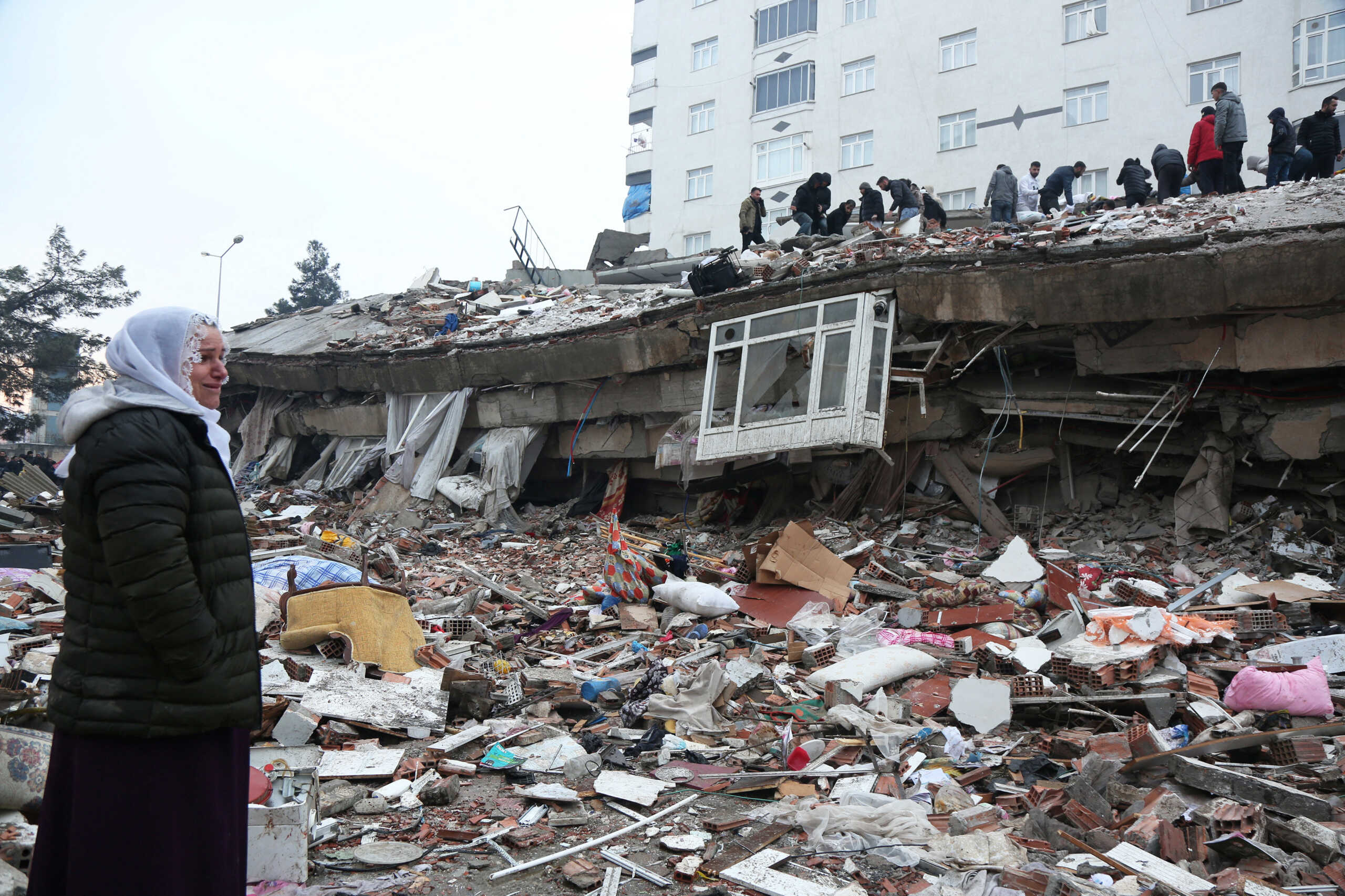 People search for survivors under the rubble following an earthquake in Diyarbakir, Turkey February 6, 2023. REUTERS