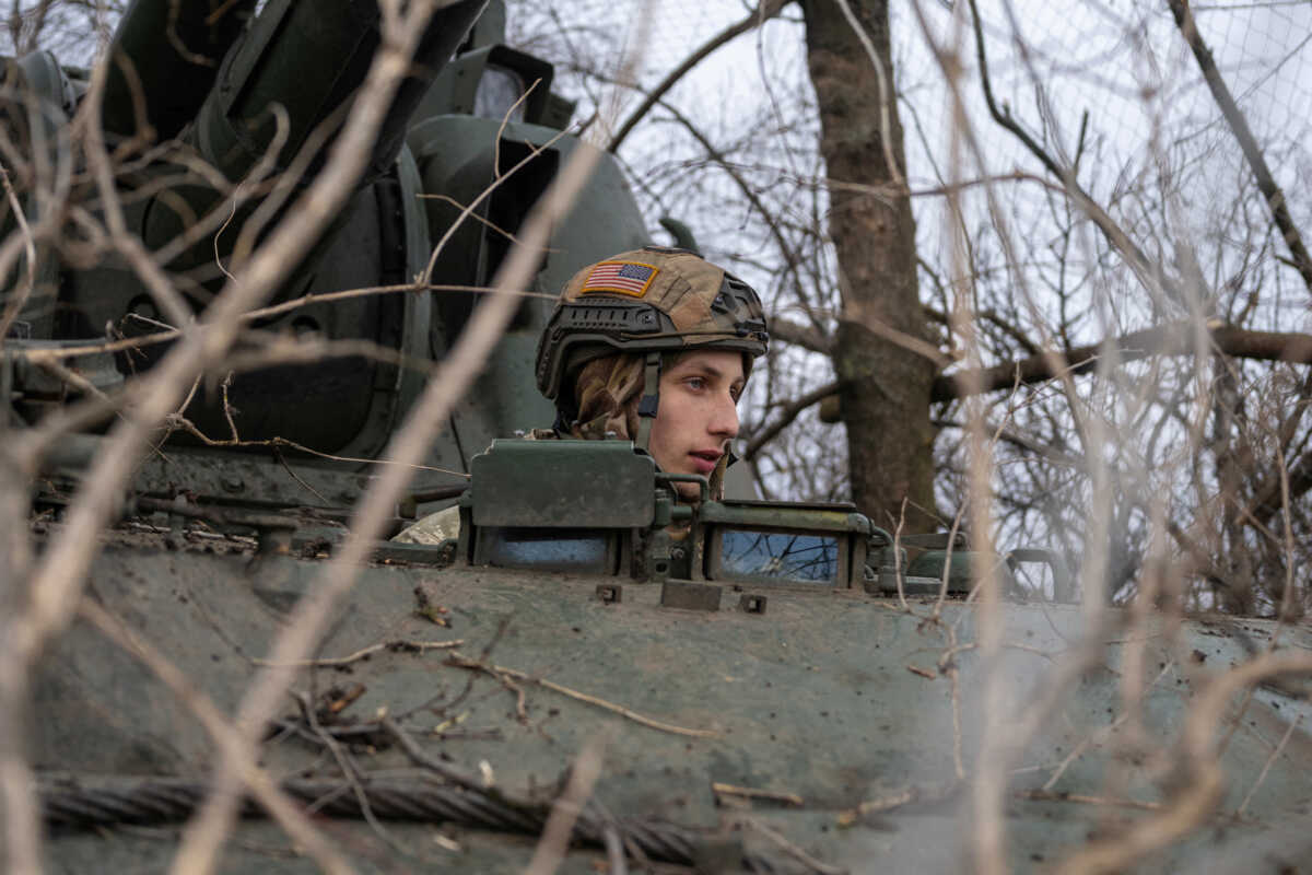 FILE PHOTO: A Ukrainian serviceman of the 28th Independent Mechanised Brigade sits inside 2S3 Akatsiya self-propelled howitzer, near the frontline town of Bakhmut, as Russia's attack on Ukraine continues, Donetsk region, Ukraine February 25, 2023. REUTERS