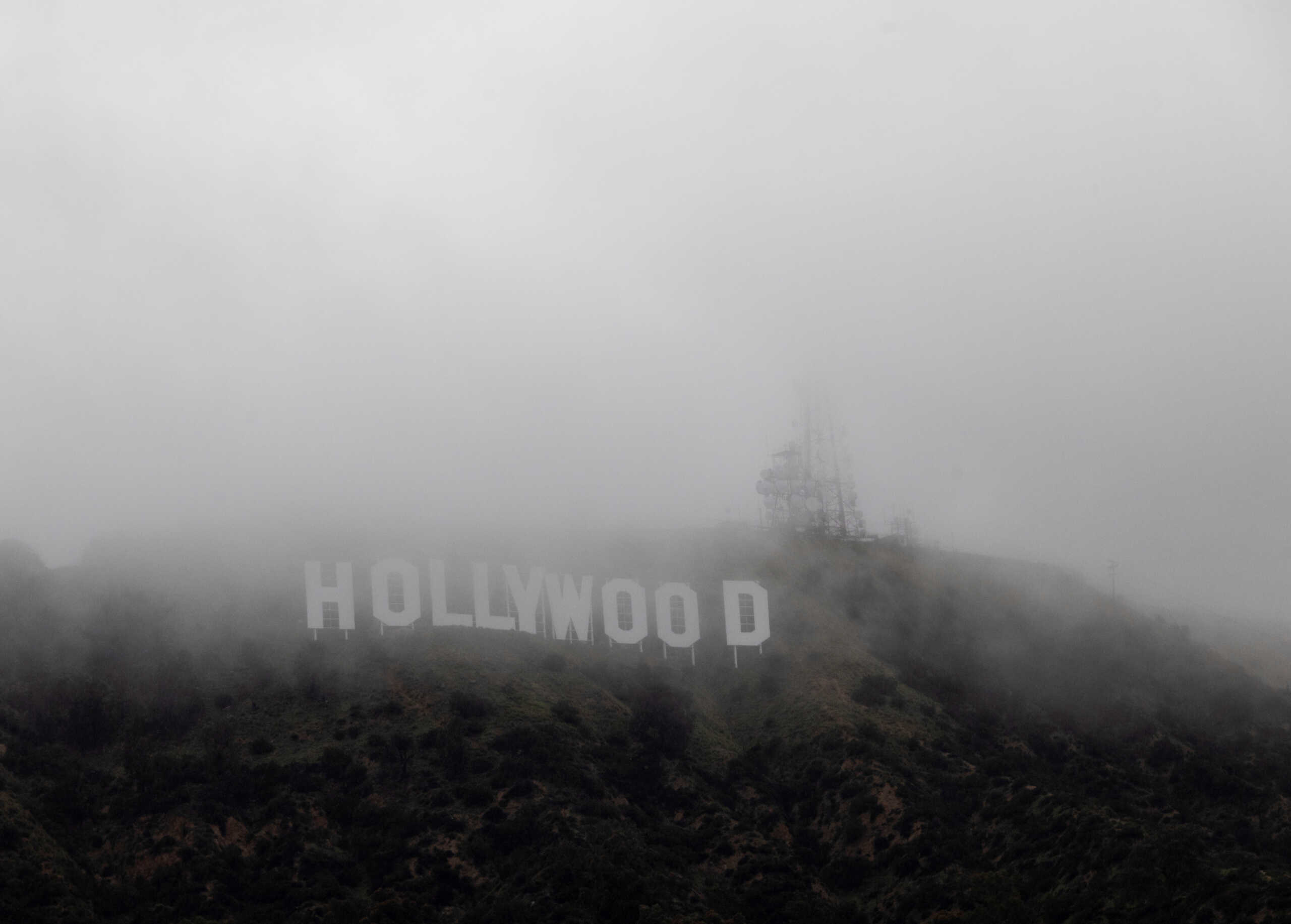The Hollywood sign is seen through clouds during rare cold winter weather, in Los Angeles, California, U.S., February 24, 2023.  REUTERS