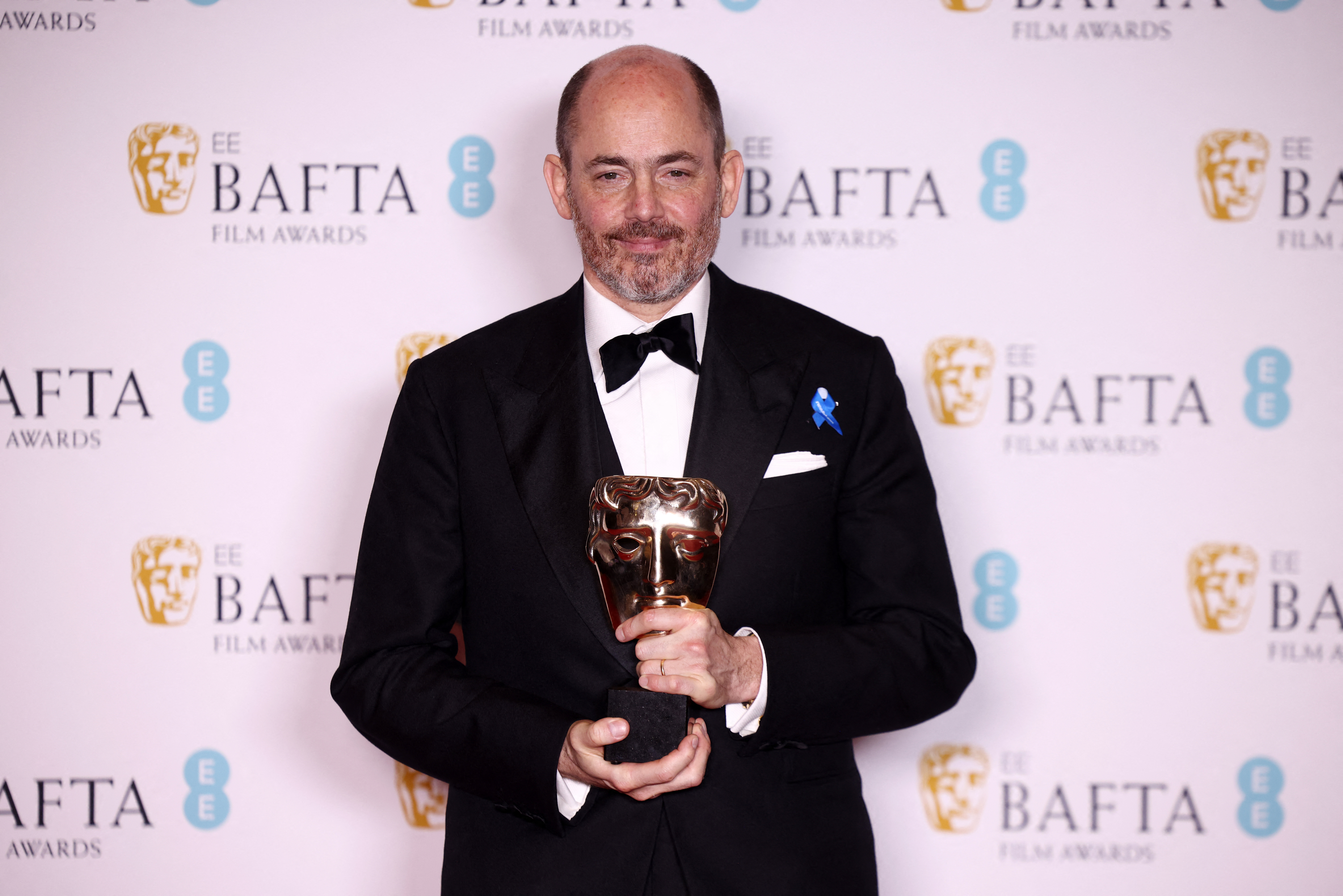 Edward Berger poses with his award for Best Director for 'All Quiet on the Western Front' during the 2023 British Academy of Film and Television Arts (BAFTA) Film Awards at the Royal Festival Hall in London, Britain, February 19, 2023. REUTERS