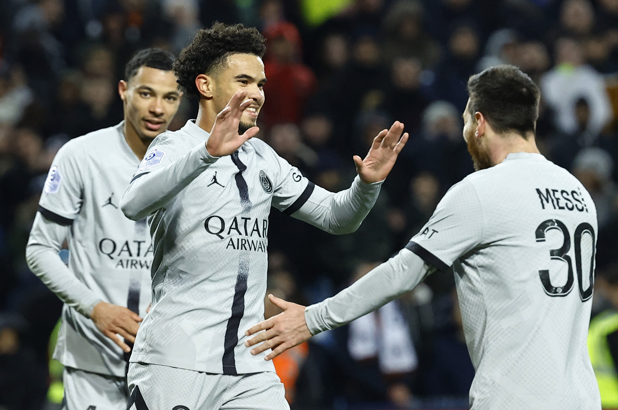 Soccer Football - Ligue 1 - Montpellier v Paris St Germain - Stade de la Mosson, Montpellier, France - February 1, 2023 Paris St Germain's Warren Zaire-Emery celebrates scoring their third goal with Lionel Messi REUTERS