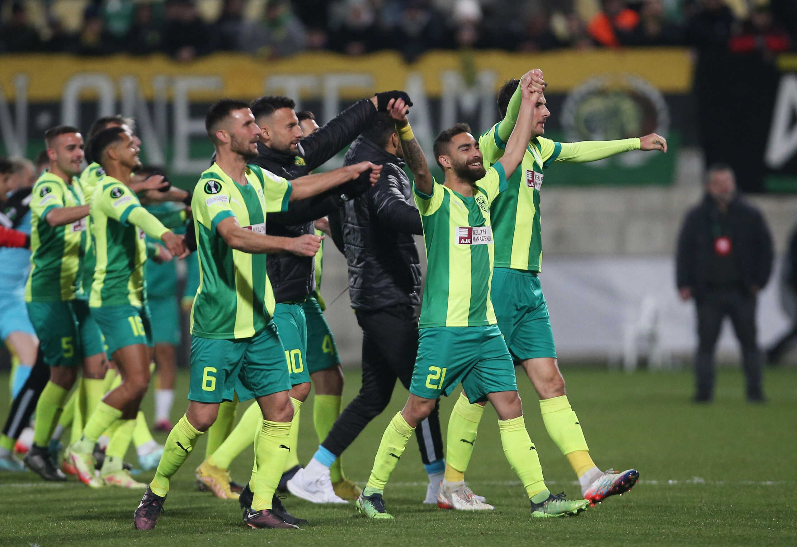 Soccer Football - Europa Conference League - Play-Off First Leg - AEK Larnaca v SC Dnipro-1 - AEK Arena, Larnaca, Cyprus - February 16, 2023 AEK Larnaca players celebrate after the match REUTERS
