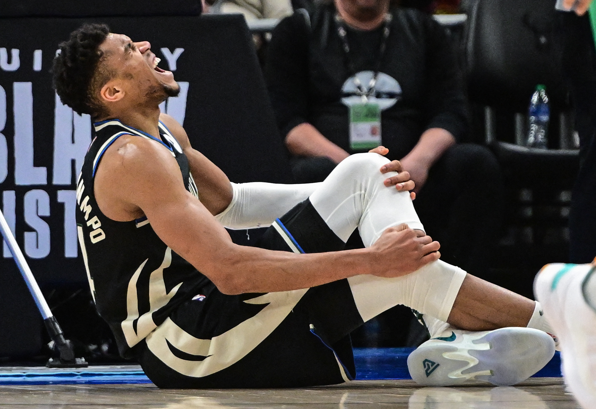 Feb 14, 2023; Milwaukee, Wisconsin, USA;  Milwaukee Bucks forward Giannis Antetokounmpo (34) reacts after a hard fall in the fourth quarter during game against the Boston Celtics at Fiserv Forum. Mandatory Credit: Benny Sieu-USA TODAY Sports
