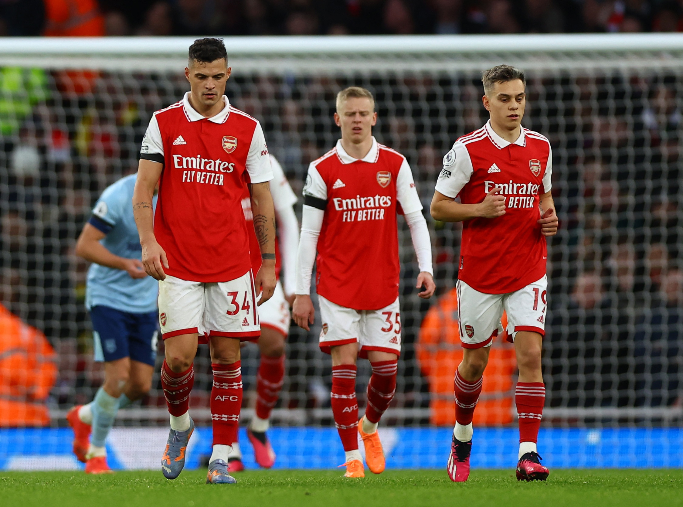 Soccer Football - Premier League - Arsenal v Brentford - Emirates Stadium, London, Britain - February 11, 2023 Arsenal's Granit Xhaka, Oleksandr Zinchenko and Leandro Trossard look dejected after conceding their first goal Action Images via Reuters