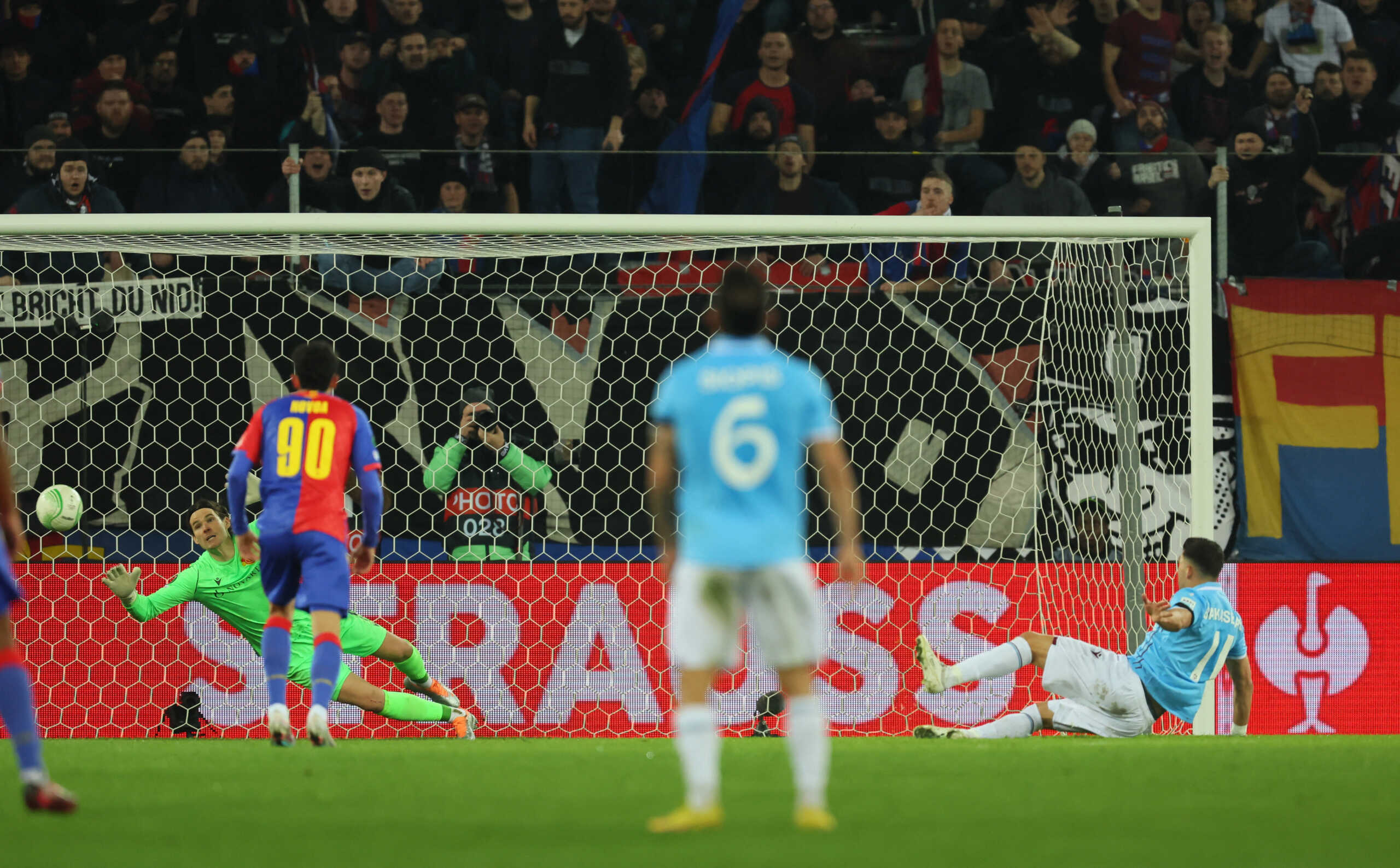 Soccer Football - Europa Conference League - Play-Off Second Leg - Basel v Trabzonspor - St. Jakob-Park, Basel, Switzerland - February 23, 2023 Trabzonspor's Anastasios Bakasetas misses from the penalty spot as Basel's Marwin Hitz dives REUTERS