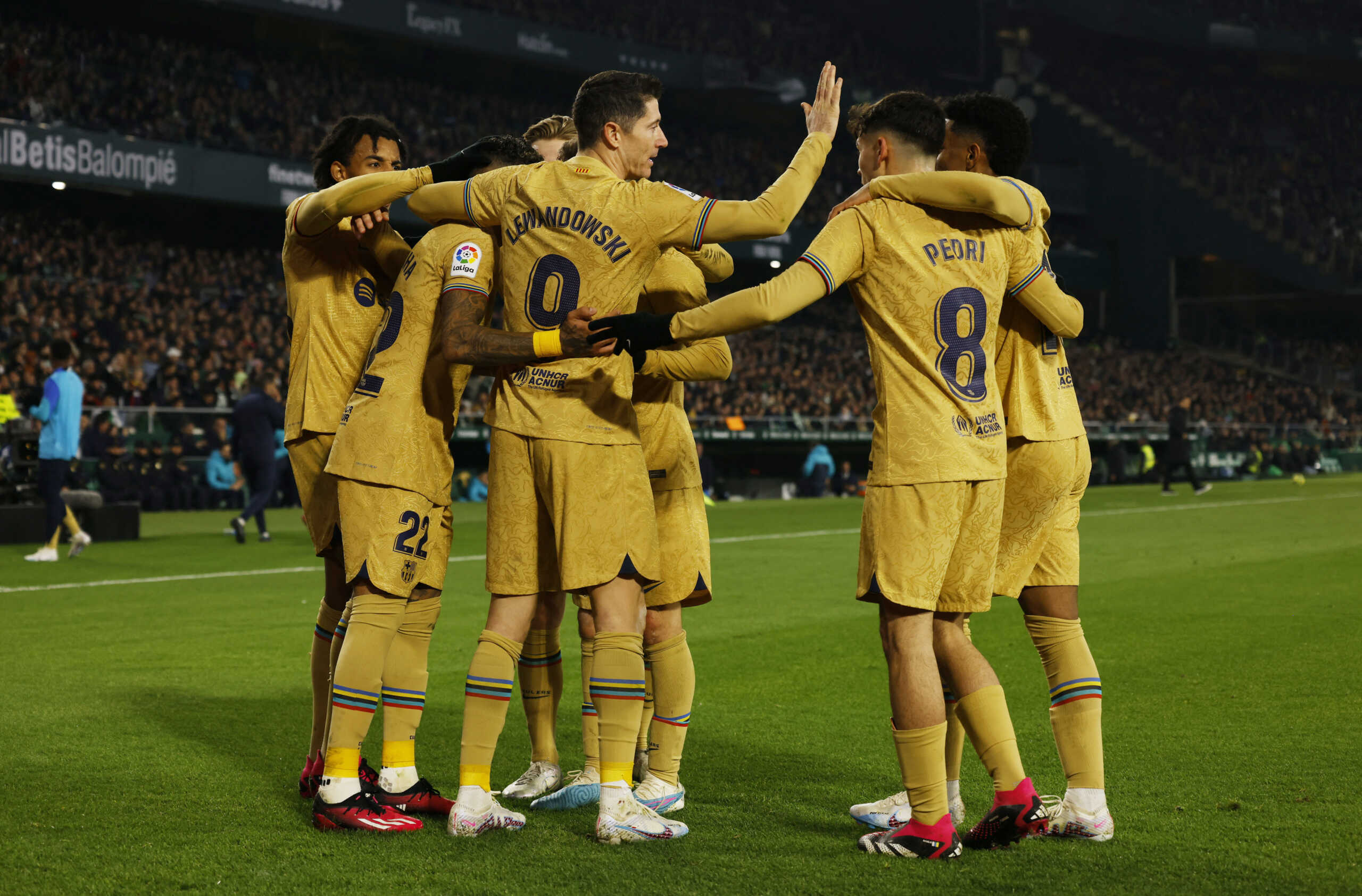 Soccer Football - LaLiga - Real Betis v FC Barcelona - Estadio Benito Villamarin, Seville, Spain - February 1, 2023 FC Barcelona's Raphinha celebrates scoring their first goal with teammates REUTERS
