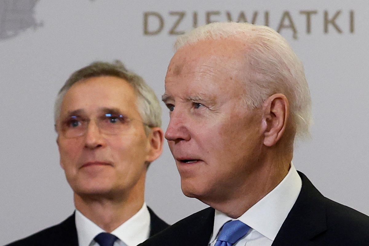 U.S. President Joe Biden and NATO Secretary-General Jens Stoltenberg pose for a group photo during the NATO Bucharest Nine (B9) Summit, during Biden's visit to Poland to mark the first anniversary of Russia's invasion of Ukraine, the Presidential Palace in Warsaw, Poland, February 22, 2023. REUTERS