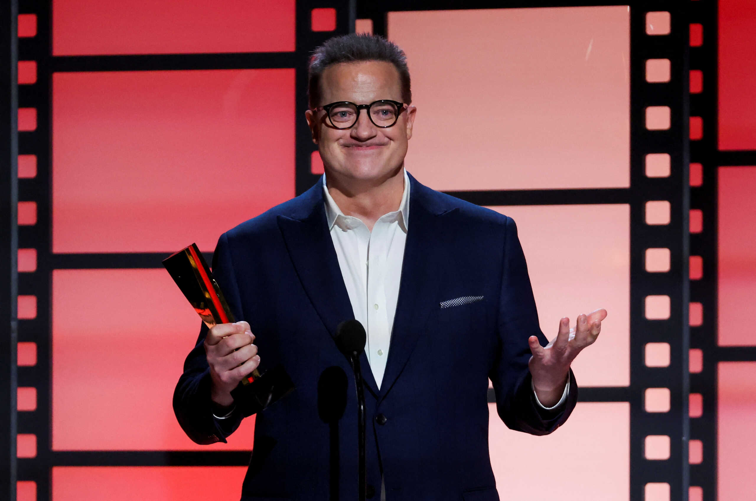 Brendan Fraser reacts after receiving the Best Actor award during the AARP 21st Annual Movies for Grownups Awards in Beverly Hills, California, U.S., January 28, 2023. REUTERS