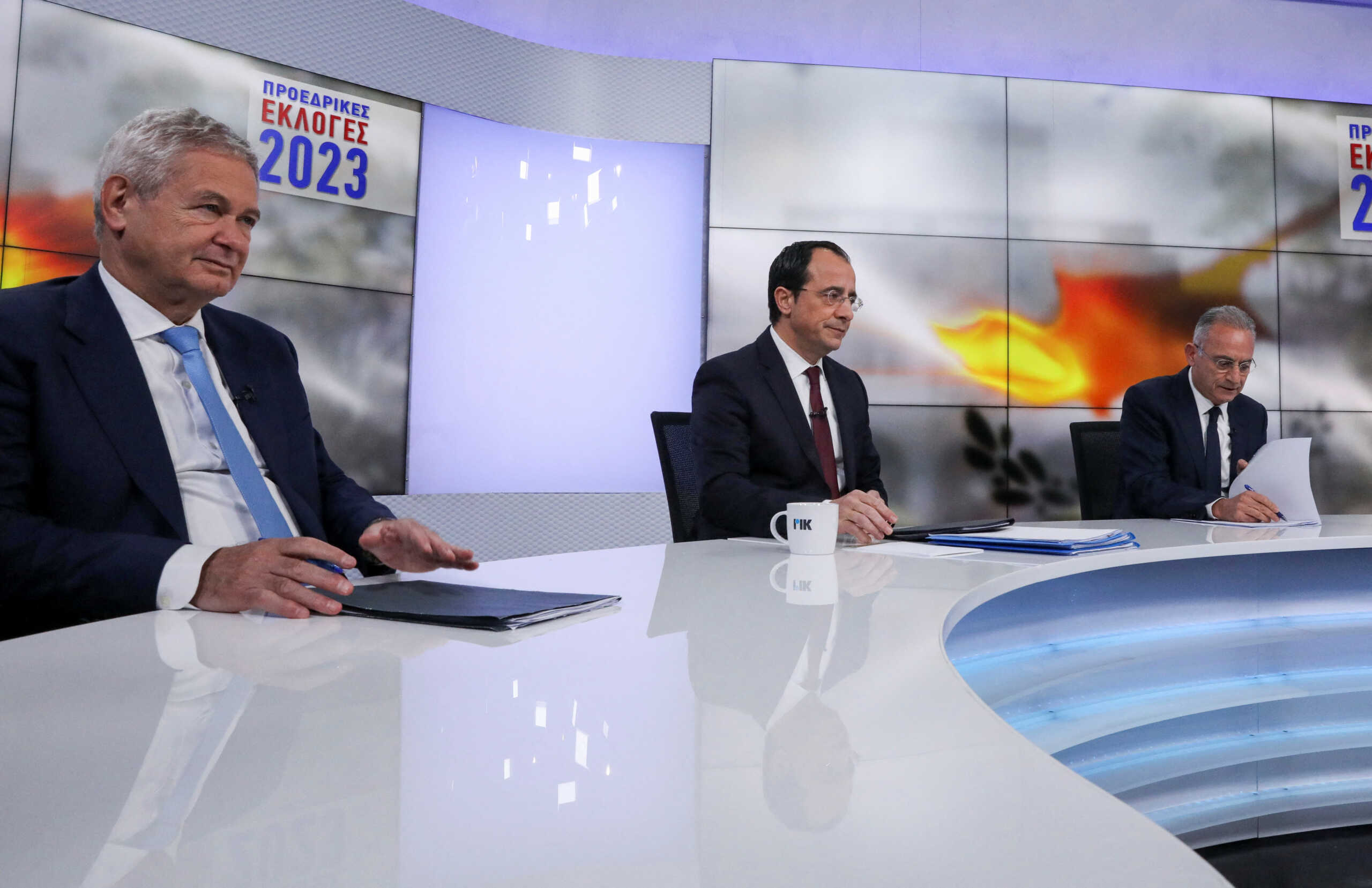 Cyprus presidential candidates Andreas Mavroyiannis, backed by left-wing AKEL, Nikos Christodoulides, independent and former Minister of Foreign Affairs and Averof Neophytou, head of the governing right-wing Democratic Rally party attend a televised debate in Nicosia, Cyprus February 1, 2023. REUTERS