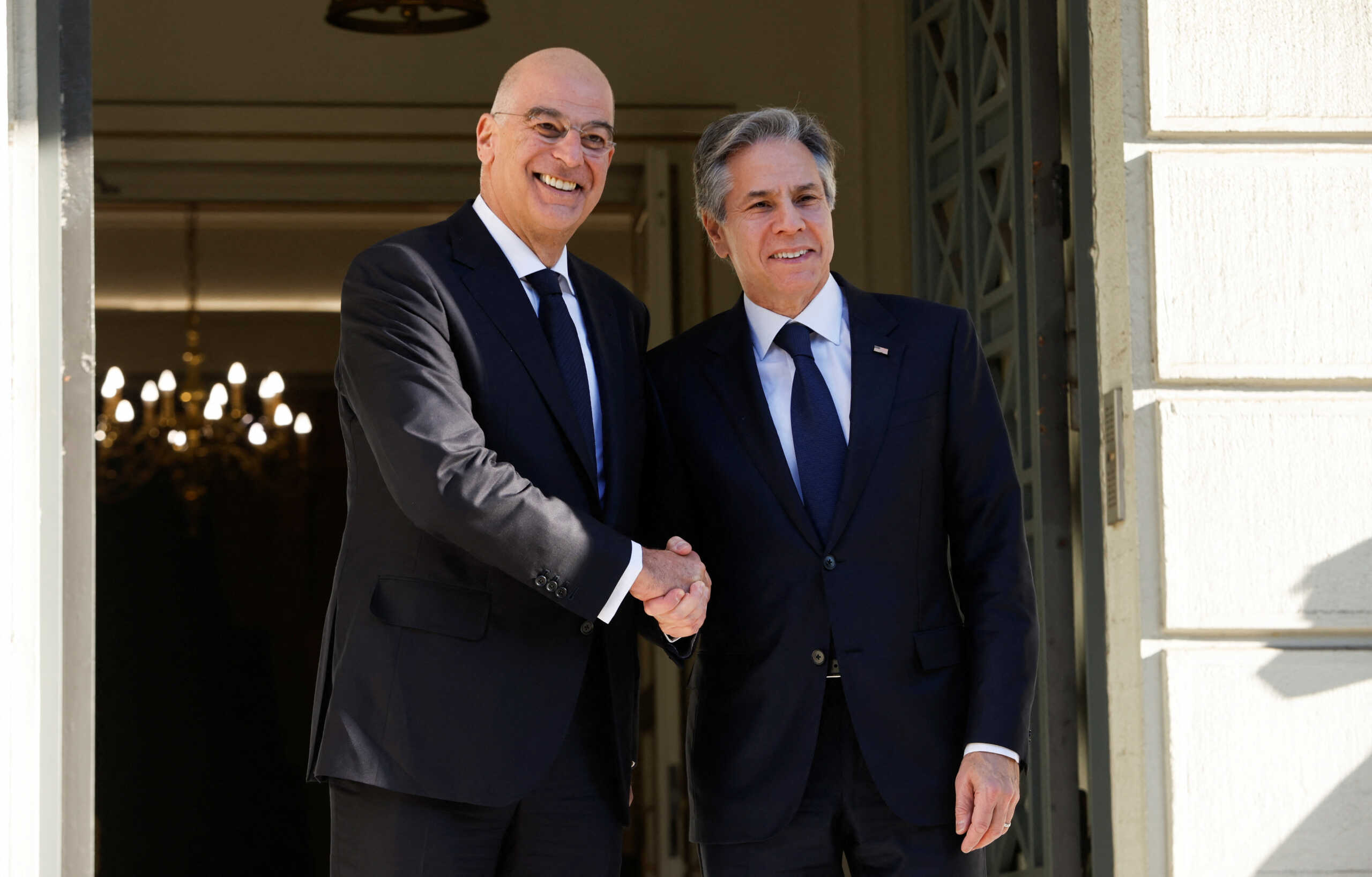 Greek Foreign Minister Nikos Dendias welcomes U.S. Secretary of State Antony Blinken at the Foreign Ministry in Athens, Greece, February 21, 2023. REUTERS