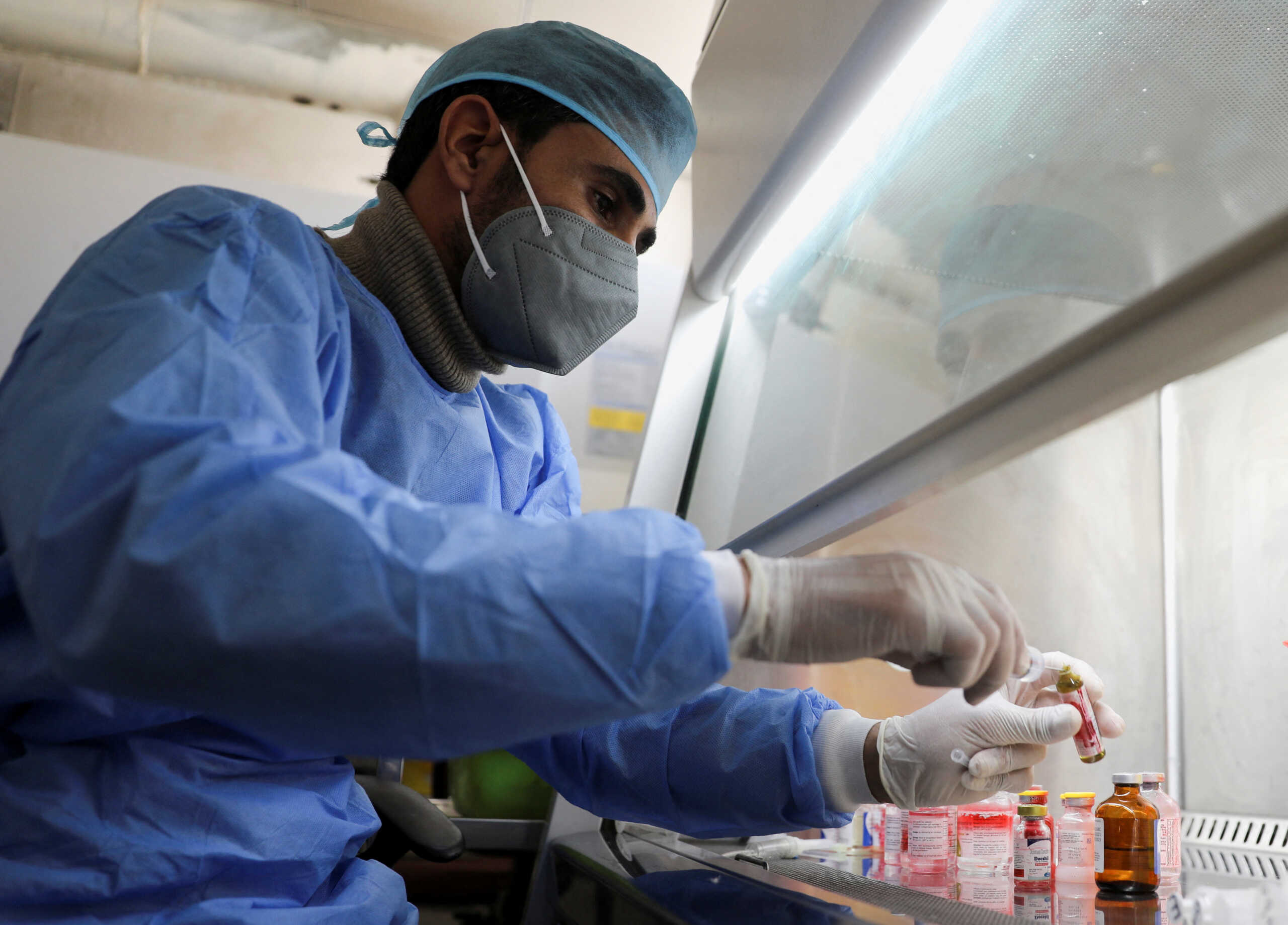 An employee of the National Oncology Center prepares medicines at the center in Sanaa, Yemen January 10, 2023. REUTERS
