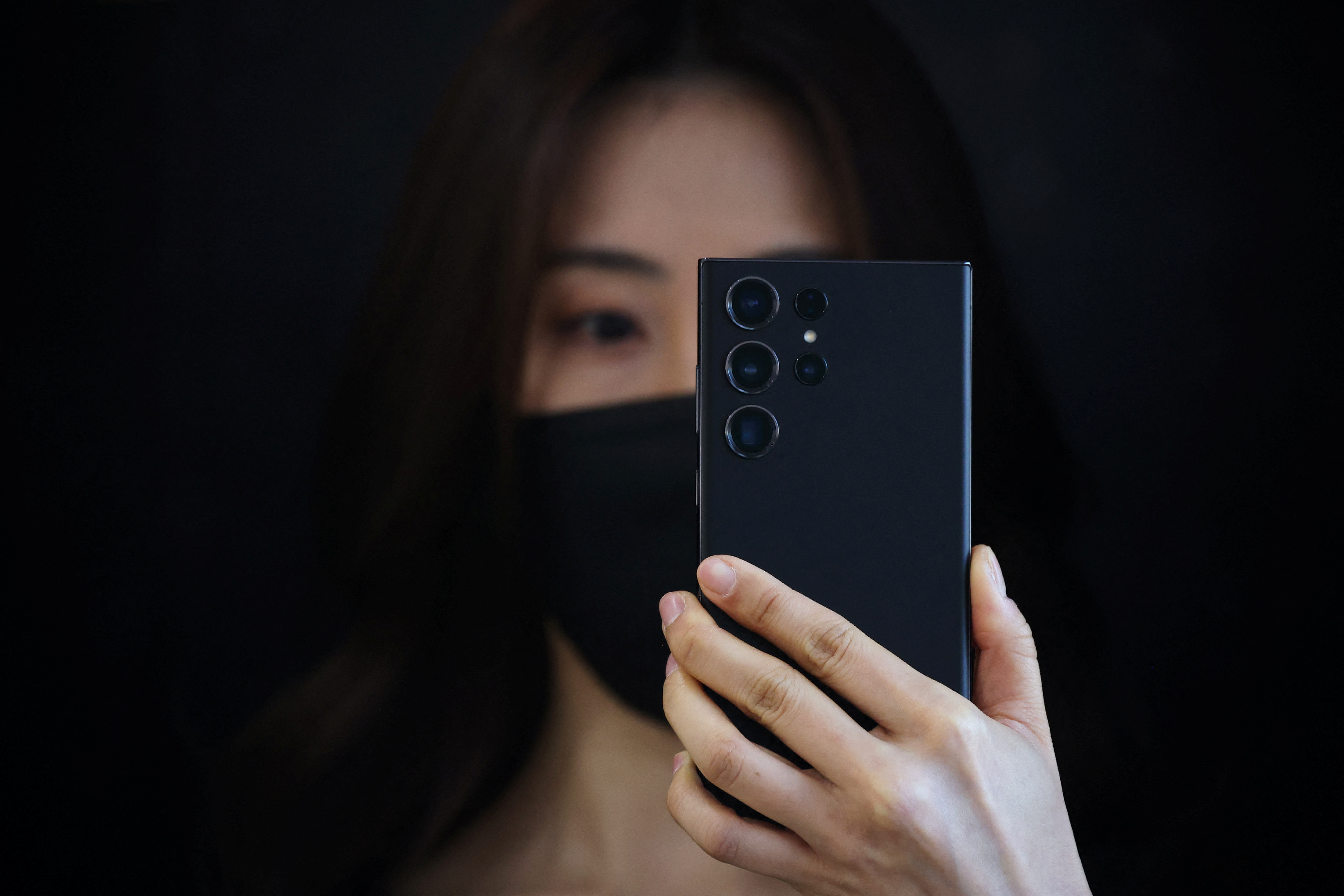 An employee demonstrates a Samsung Electronics' flagship smartphone Galaxy S23 Ultra at an unveiling ceremony in Seoul, South Korea, January 30, 2023.    REUTERS