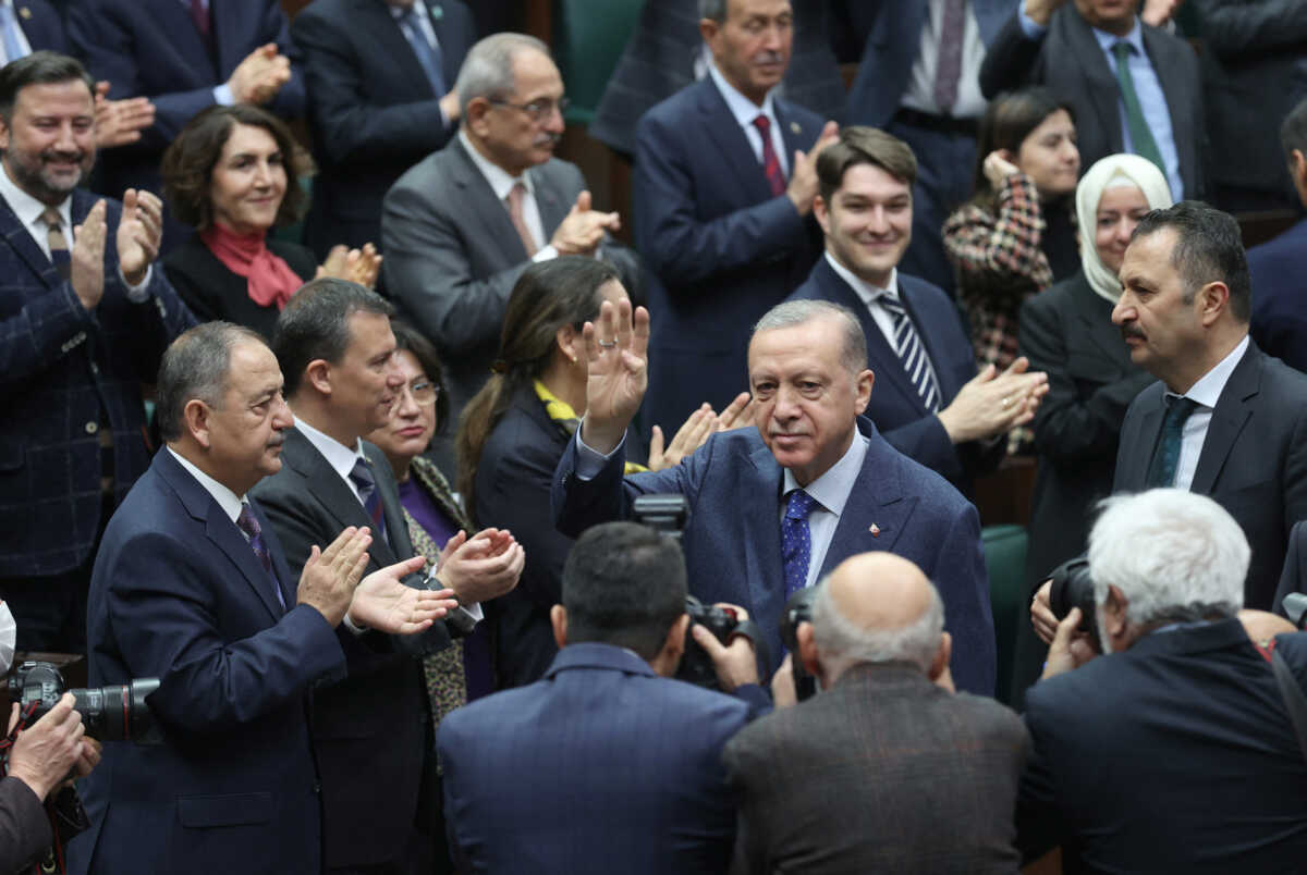 Turkish President Tayyip Erdogan greets lawmakers of his ruling AK Party during a meeting at the parliament in Ankara, Turkey February 1, 2023. Presidential Press Office