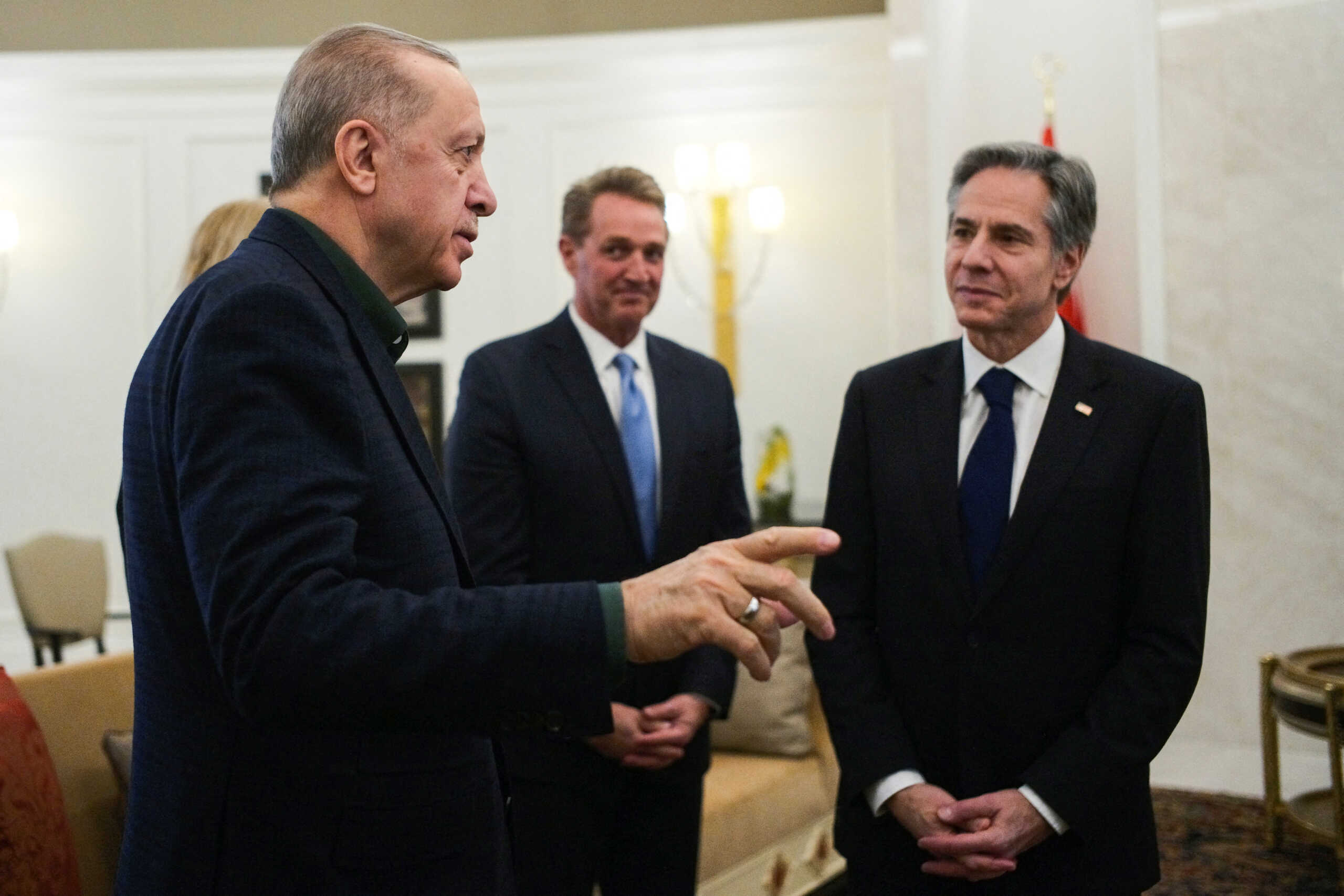 Turkish President Recep Tayyip Erdogan, talks to U.S. Secretary of State Antony Blinken during their meeting at Esenboga airport in Ankara, Turkey, Monday, February 20, 2023.     Burhan Ozbilici