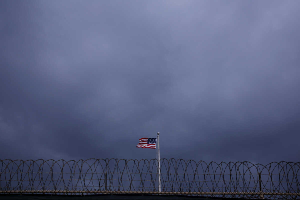 FILE PHOTO: The United States flag flies inside of Joint Task Force Guantanamo Camp VI at the U.S. Naval Base in Guantanamo Bay, Cuba March 22, 2016.  REUTERS