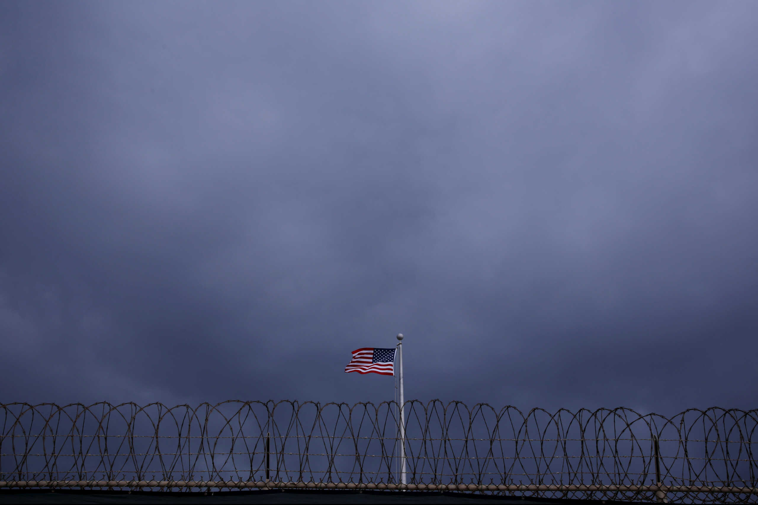 FILE PHOTO: The United States flag flies inside of Joint Task Force Guantanamo Camp VI at the U.S. Naval Base in Guantanamo Bay, Cuba March 22, 2016.  REUTERS