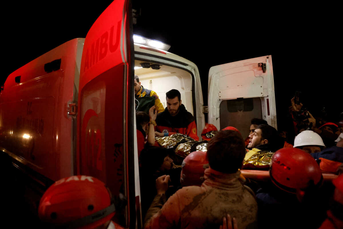 Rescuers carry Fatma to an ambulance after being rescued from the rubble of a collapsed building hours after the quake, in the aftermath of a deadly earthquake in Hatay, Turkey February 14, 2023. REUTERS