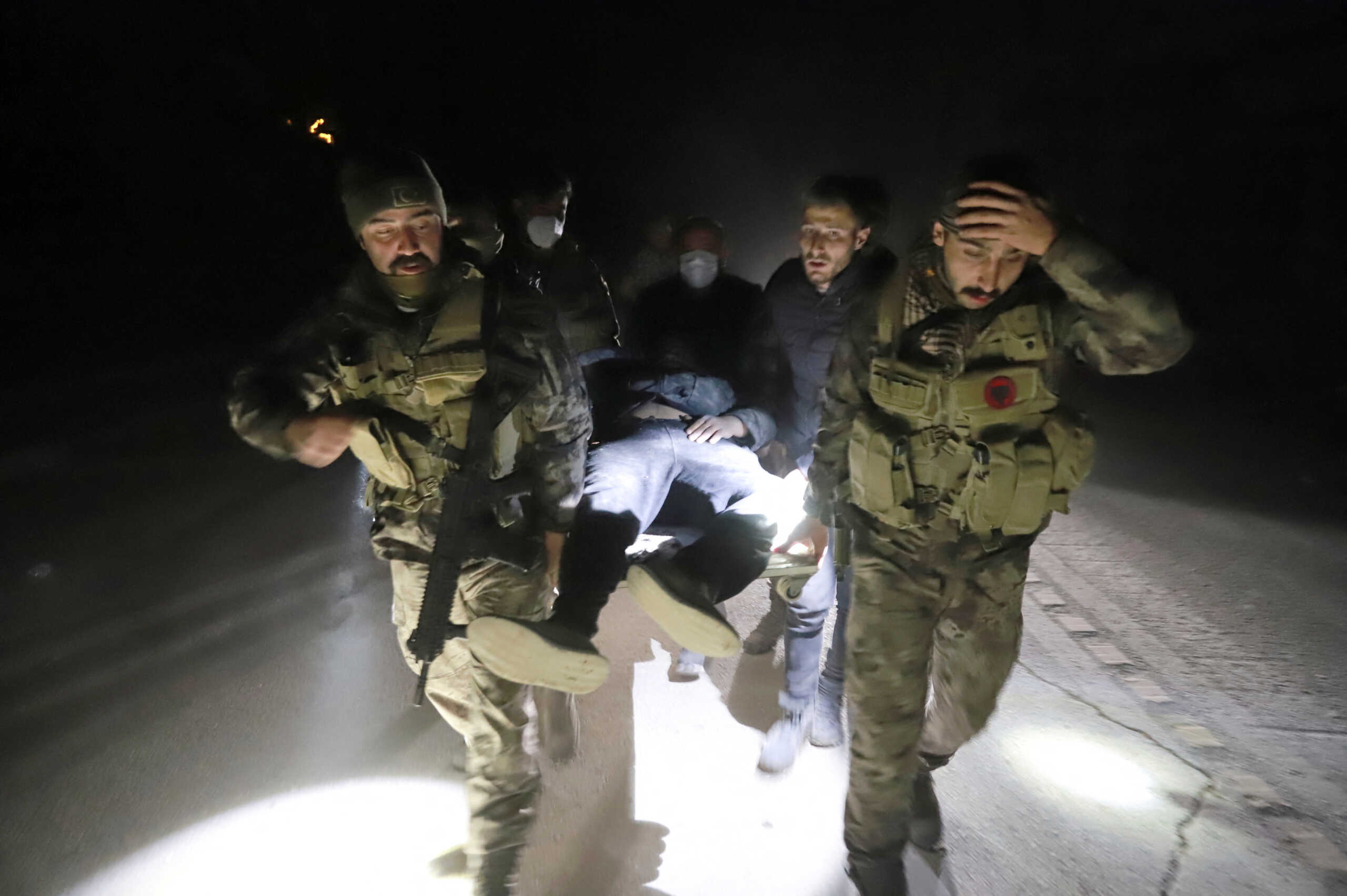 Members of Turkish police special forces carry a wounded man after an earthquake in Antakya, Hatay province, Turkey February 20, 2023. REUTERS