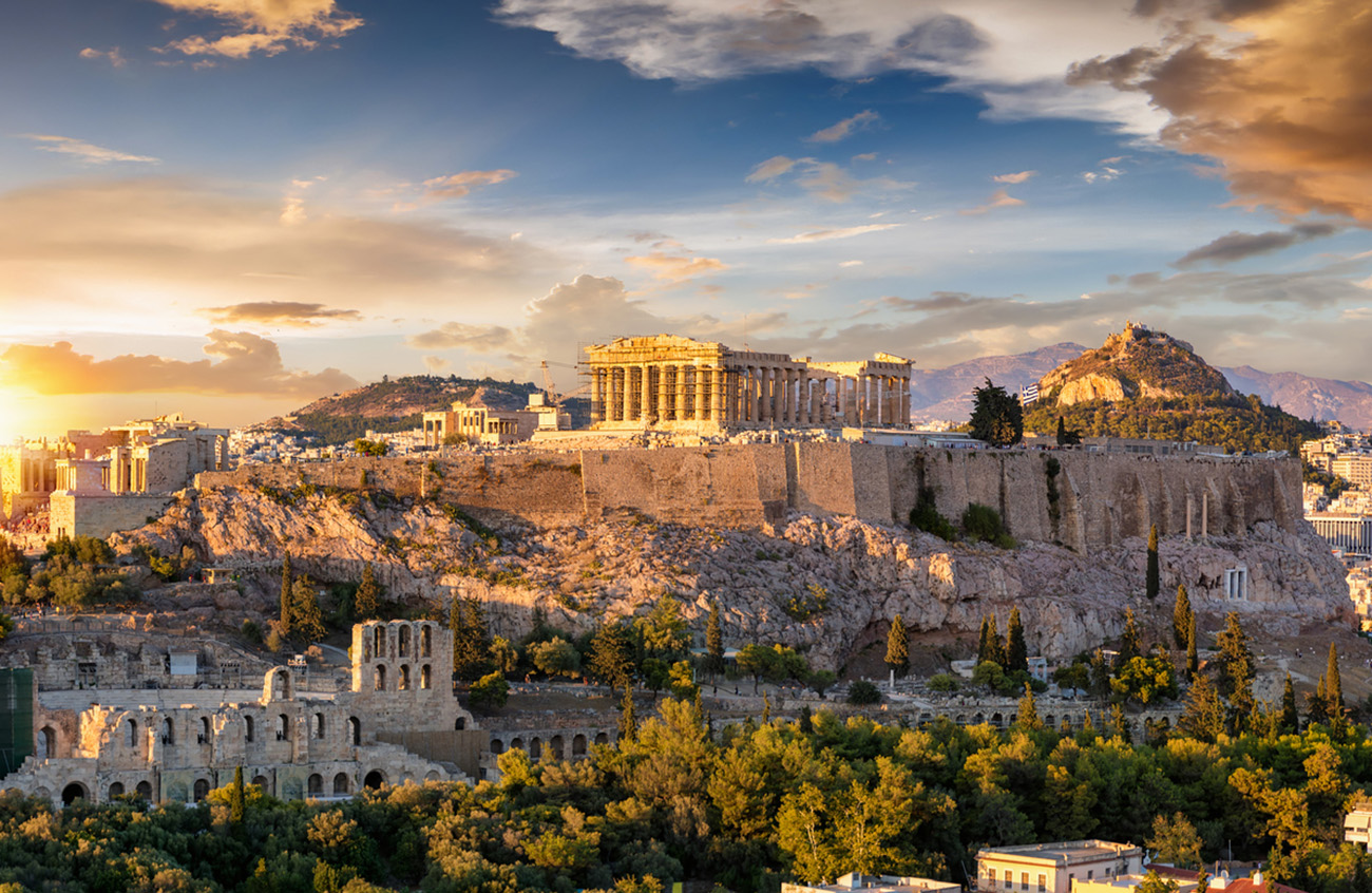 The Acropolis of Athens, Greece, with the Parthenon Temple on top of the hill during a summer sunset