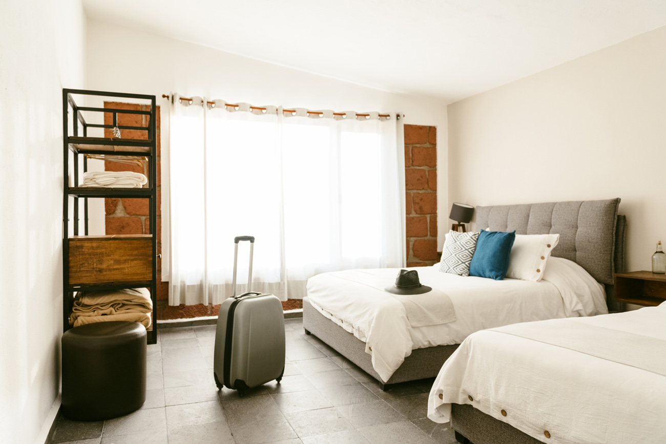 Backlit suitcase in hotel room