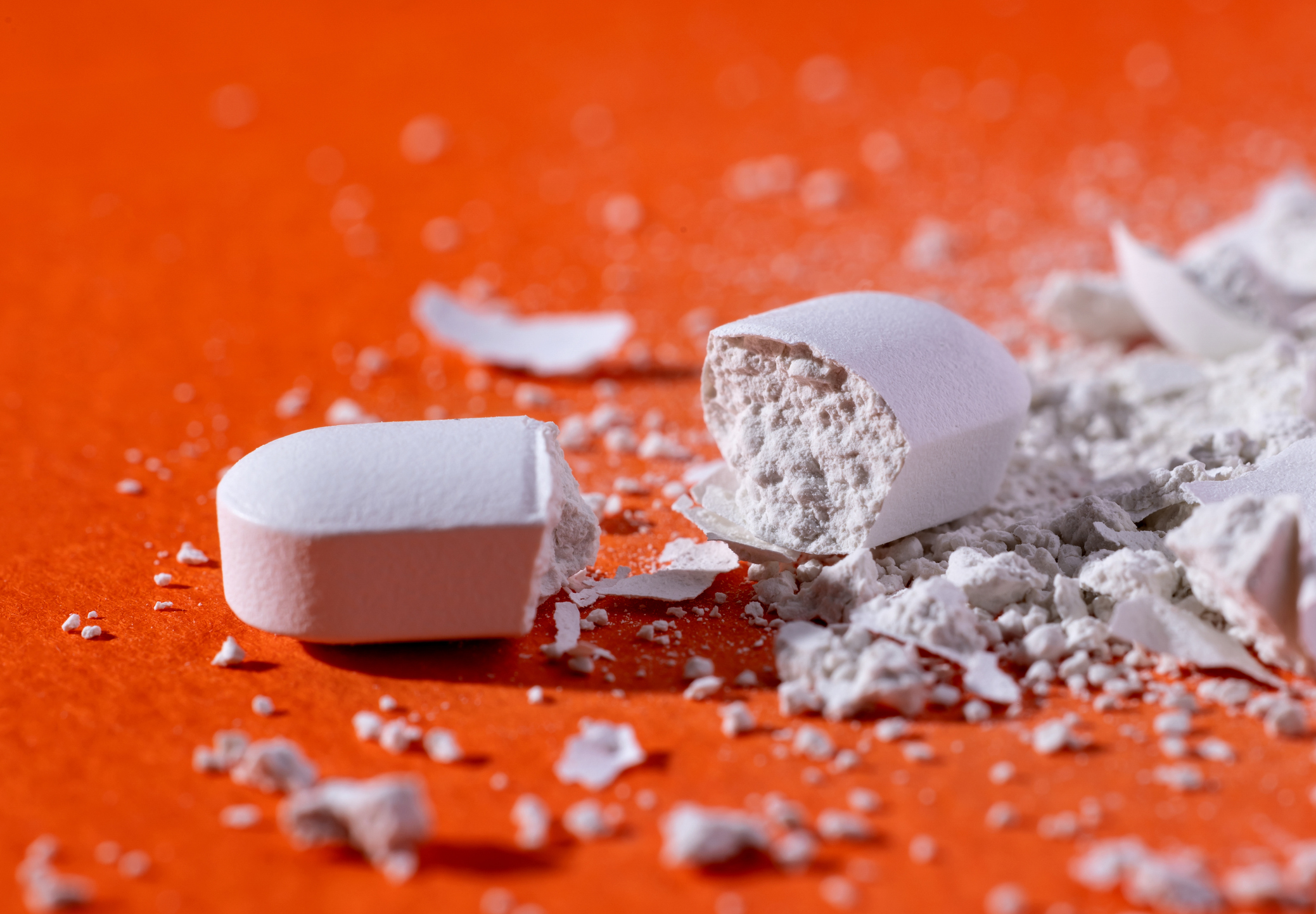 Drugs, pills are cut and scattered on the floor