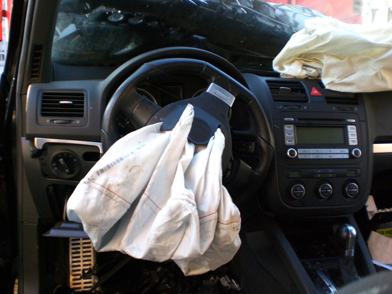 Frontal crash, total loss car, airbags deployed inside car after wreck