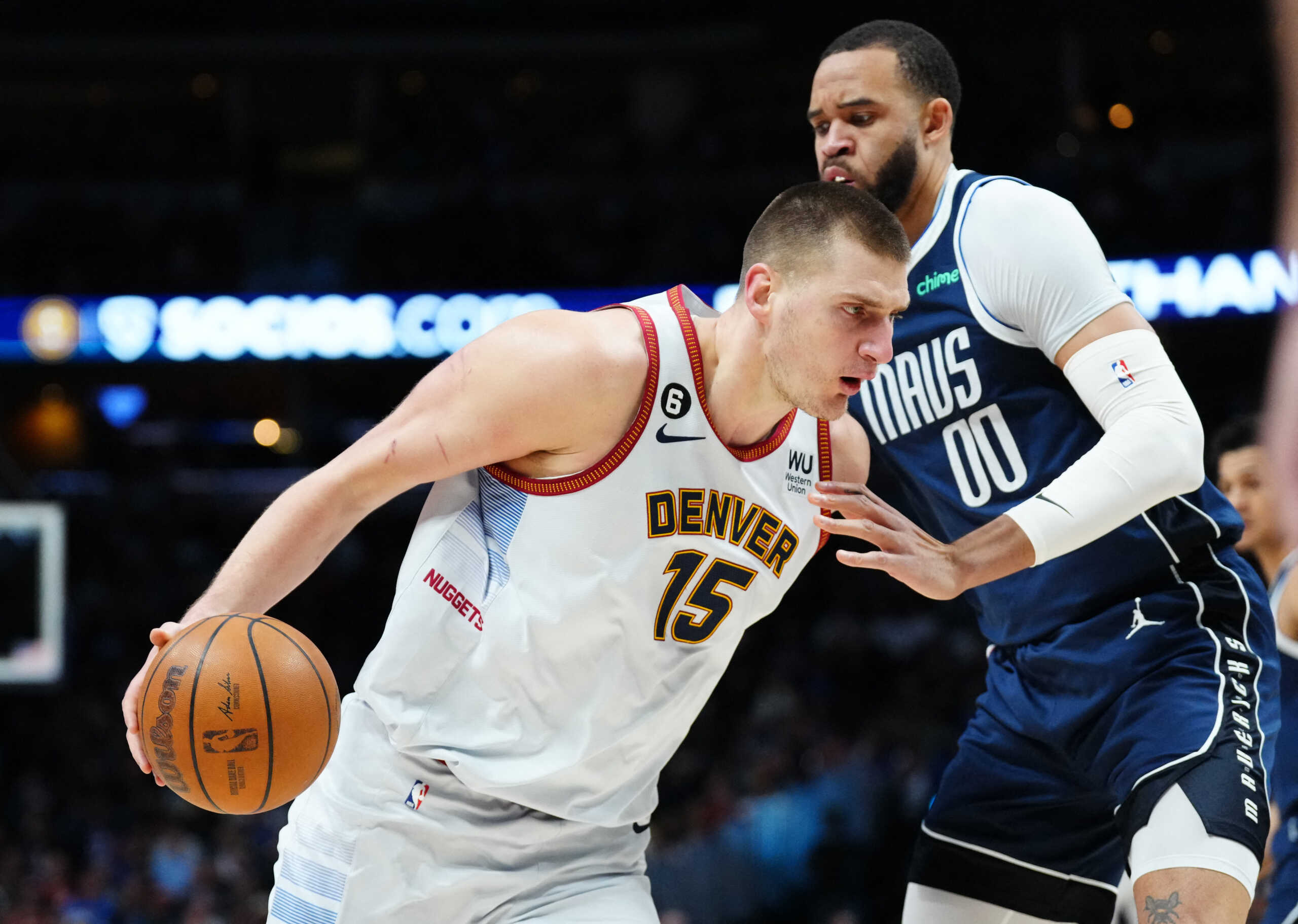 Feb 15, 2023; Denver, Colorado, USA; Dallas Mavericks center JaVale McGee (00) defends Denver Nuggets center Nikola Jokic (15) in the first quarter at Ball Arena. Mandatory Credit: Ron Chenoy-USA TODAY Sports