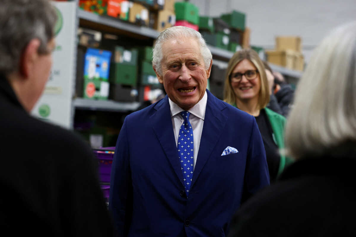 Britain's King Charles meets with volunteers during his visit to the Milton Keynes food bank in Milton Keynes, Britain February 16, 2023. REUTERS