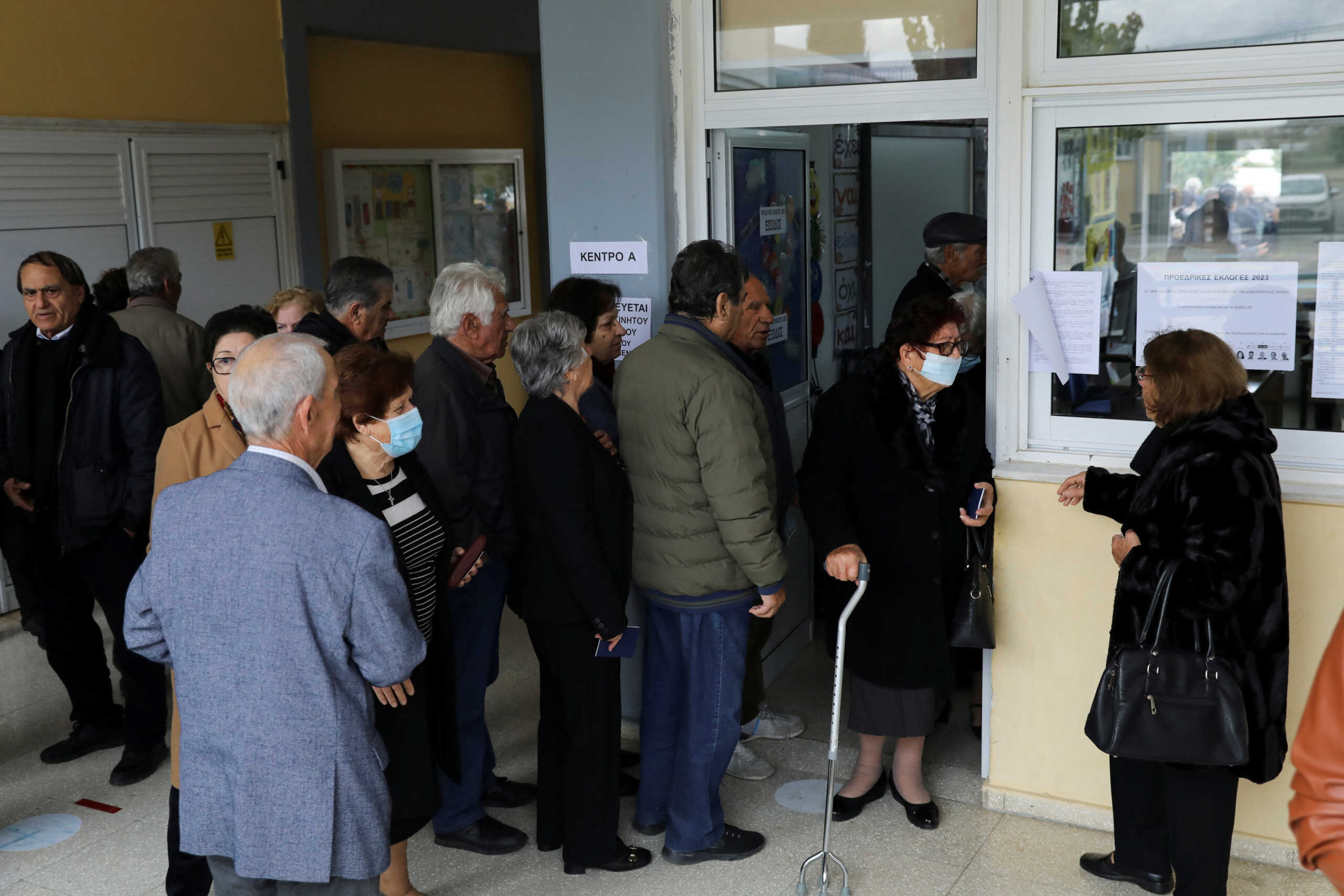 People queue outside a polling station to vote in the presidential election, in Geroskipou near Paphos, Cyprus, February 5, 2023. REUTERS