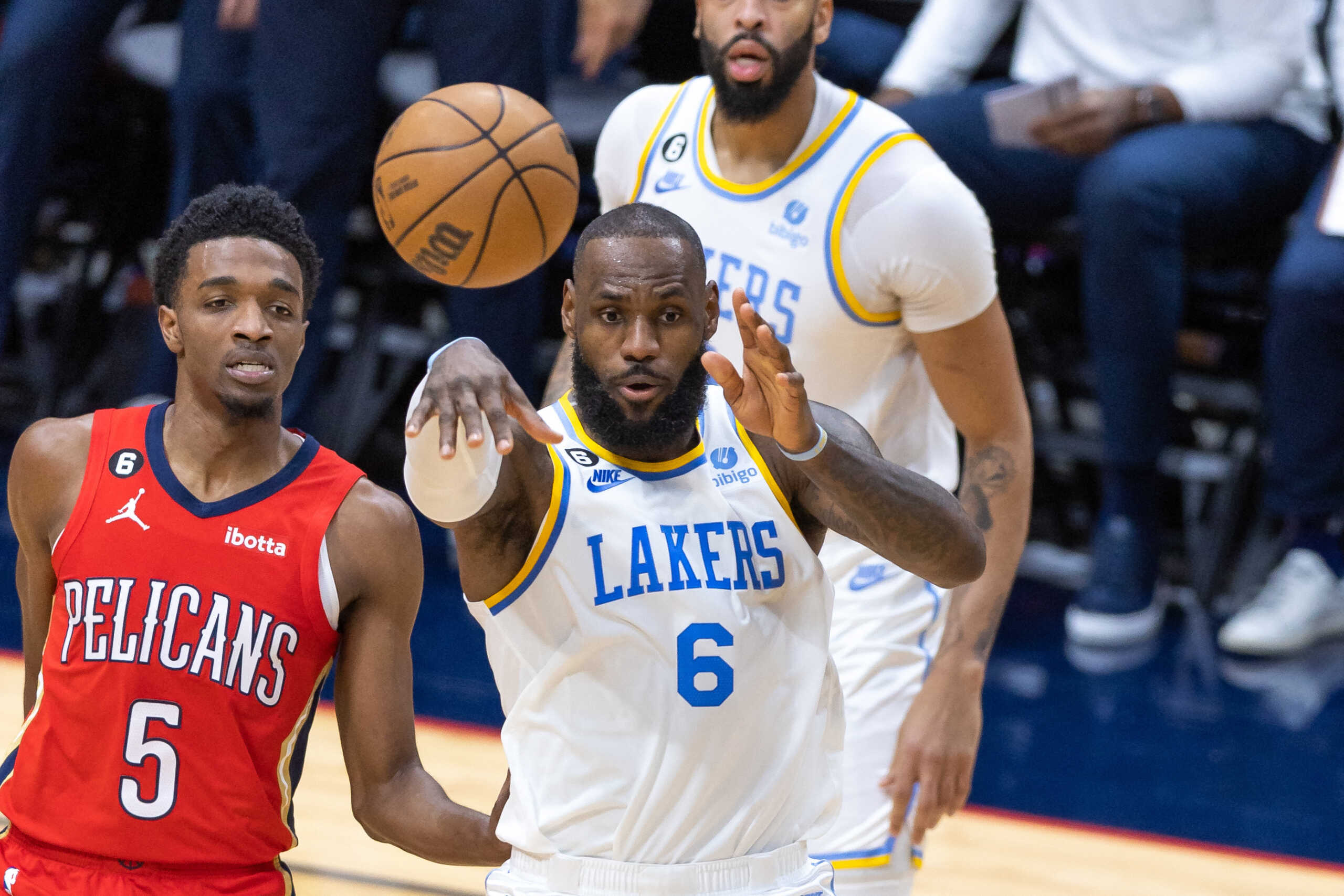 Feb 4, 2023; New Orleans, Louisiana, USA;  Los Angeles Lakers forward LeBron James (6) passes against New Orleans Pelicans forward Herbert Jones (5) during the first half at Smoothie King Center. Mandatory Credit: Stephen Lew-USA TODAY Sports