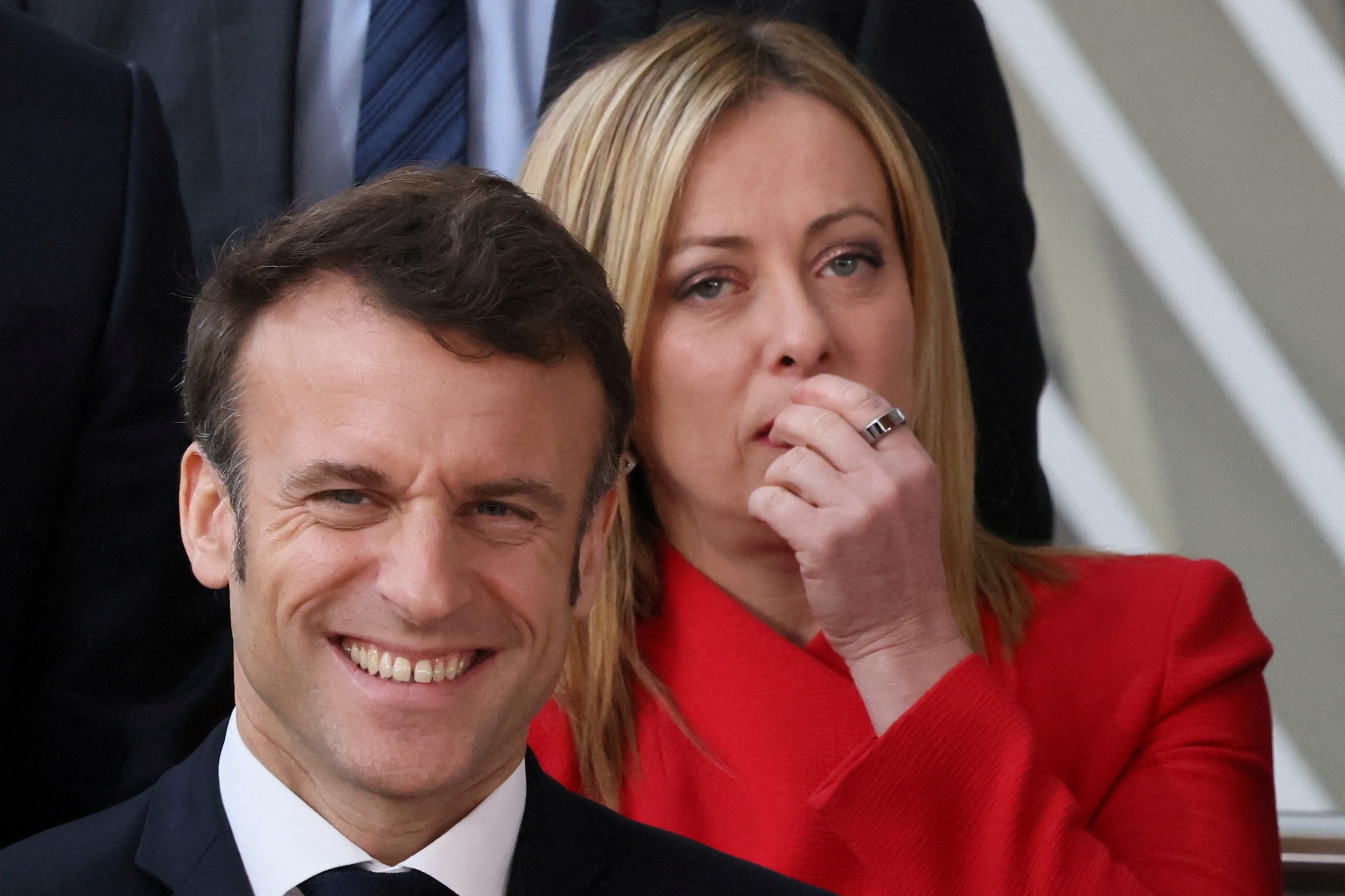 France's President Emmanuel Macron and Italy's Prime Minister Giorgia Meloni pose for a family photo as they attend the European leaders summit in Brussels, Belgium February 9, 2023. REUTERS