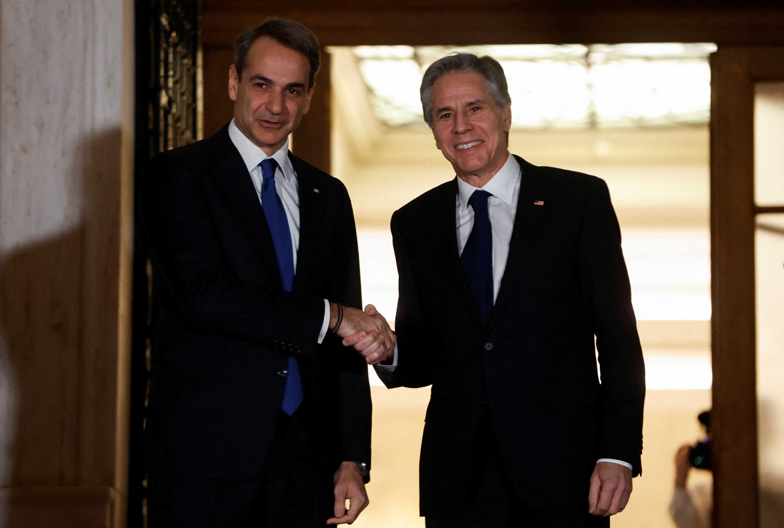 Greek Prime Minister Kyriakos Mitsotakis welcomes U.S. Secretary of State Antony Blinken at the Maximos Mansion in Athens, Greece, February 20, 2023. REUTERS