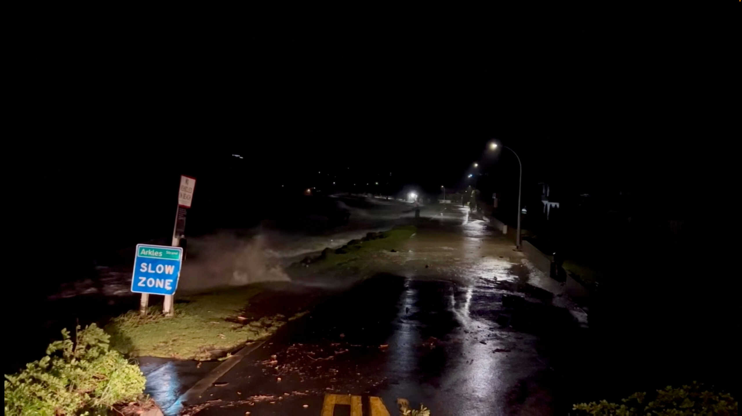 A view shows high tides rising due to Cyclone Gabrielle in Arkles Bay, Auckland, New Zealand February 13, 2023 in this screen grab obtained from a social media video. John Longson