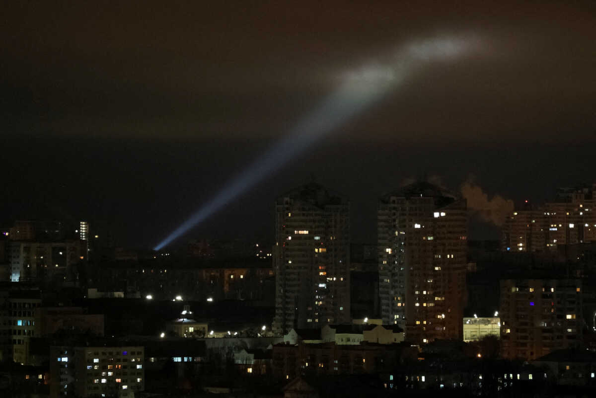 Ukrainian servicemen use a searchlight as they search for drones in the sky over the city during a Russian drone strike, amid Russia's attack on Ukraine, in Kyiv, Ukraine February 27, 2023. REUTERS