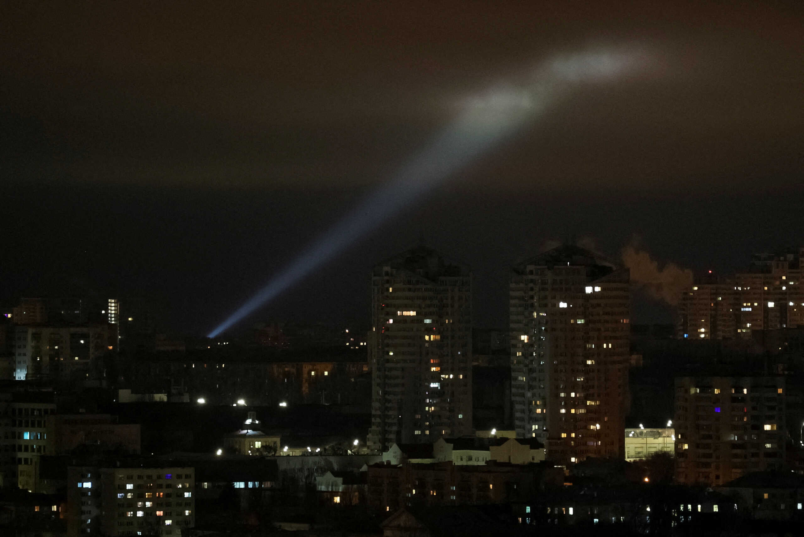 Ukrainian servicemen use a searchlight as they search for drones in the sky over the city during a Russian drone strike, amid Russia's attack on Ukraine, in Kyiv, Ukraine February 27, 2023. REUTERS