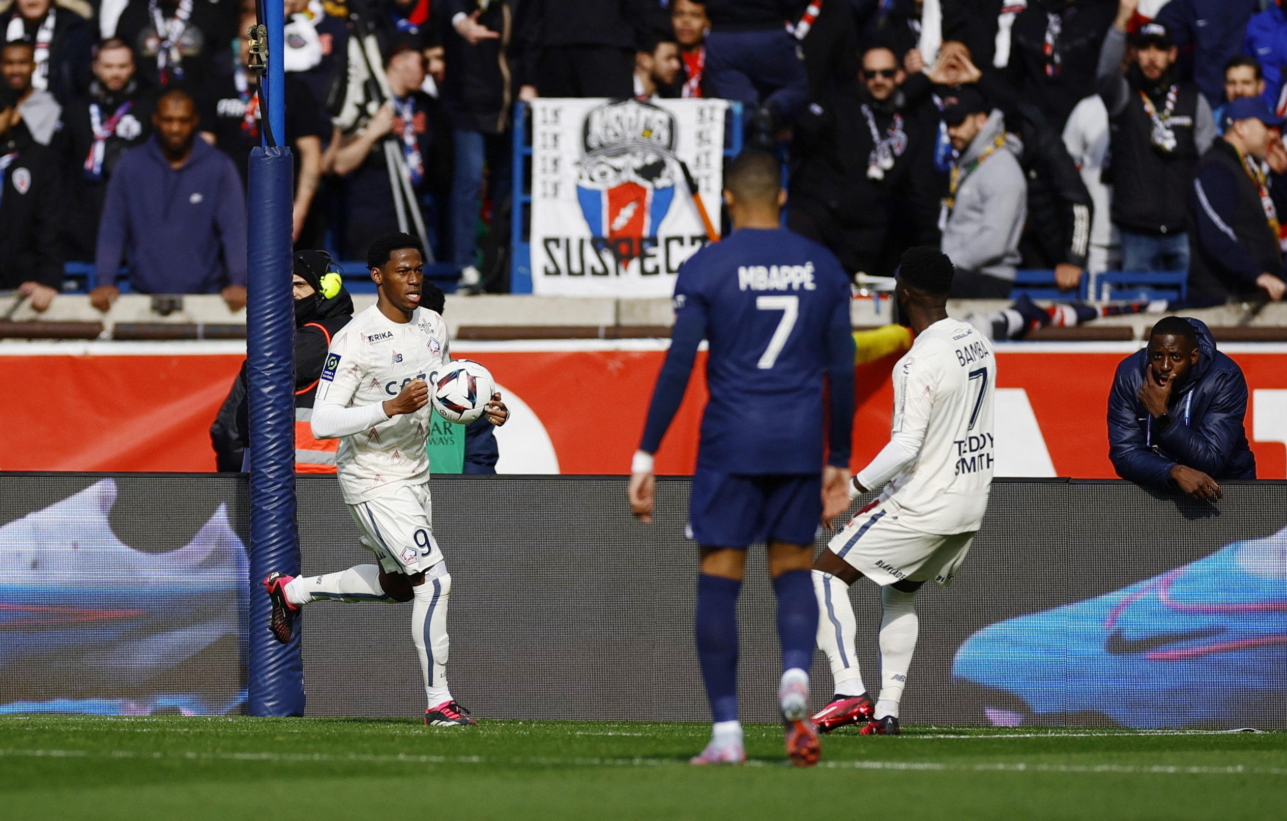 Soccer Football - Ligue 1 - Paris St Germain v Lille - Parc des Princes, Paris, France - February 19, 2023 Lille's Jonathan David celebrates scoring their second goal with Jonathan Bamba REUTERS