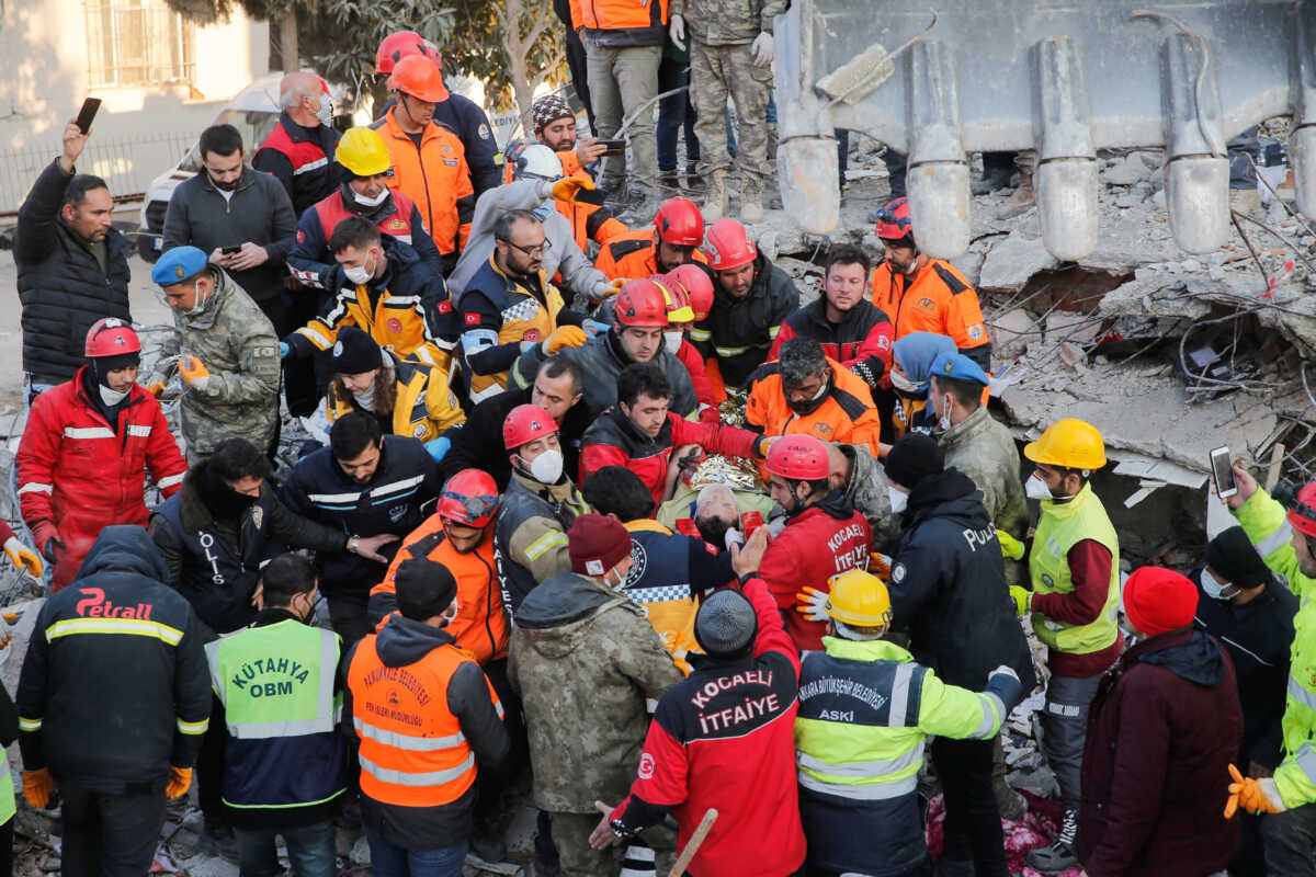 Rescuer workers carry Kaan, a-13-year old Turkish teenager, to an ambulance after being rescued from the rubble after 182 hours, in the aftermath of a deadly earthquake in Hatay, Turkey February 13, 2023. REUTERS